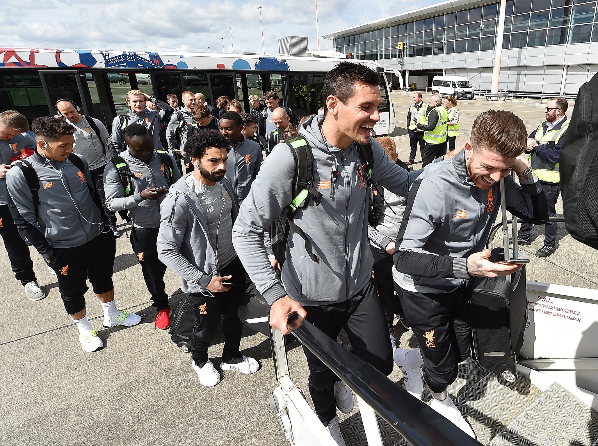 Liverpool players board their flight to Rome