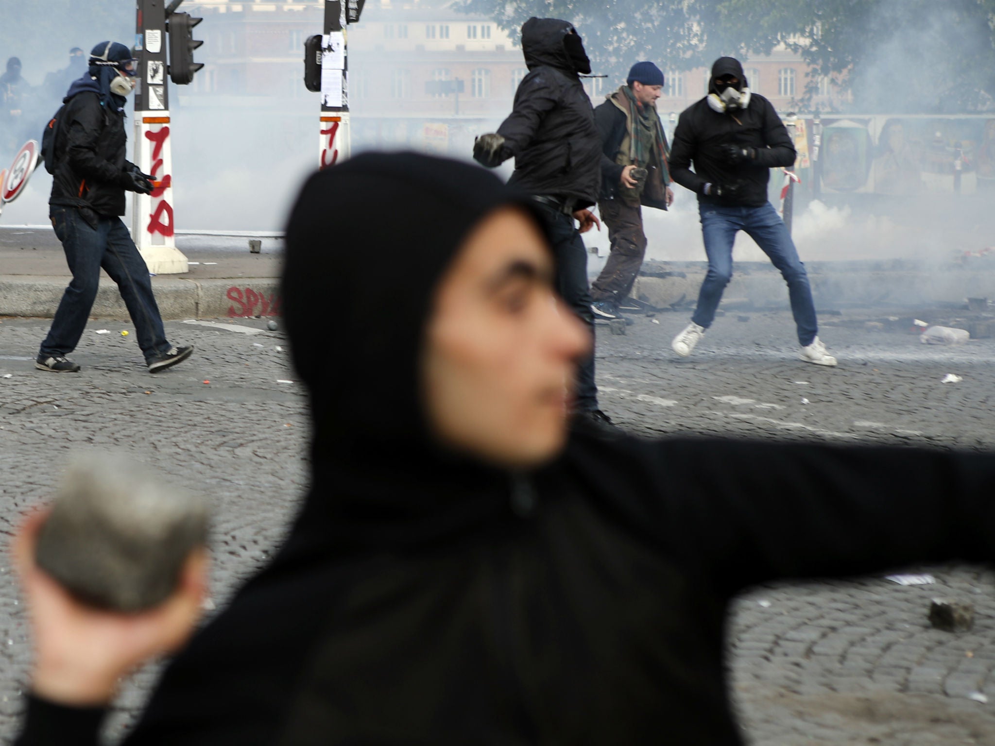 Activists clash with riot police during the a May Day rally in the centre of Paris, France