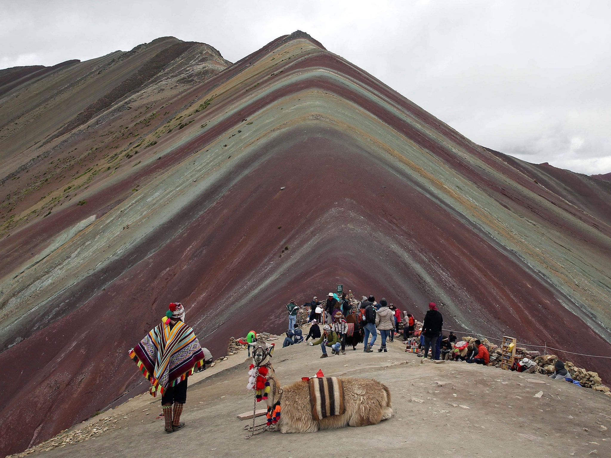 The mountain is formed of layers of multi-coloured sediment