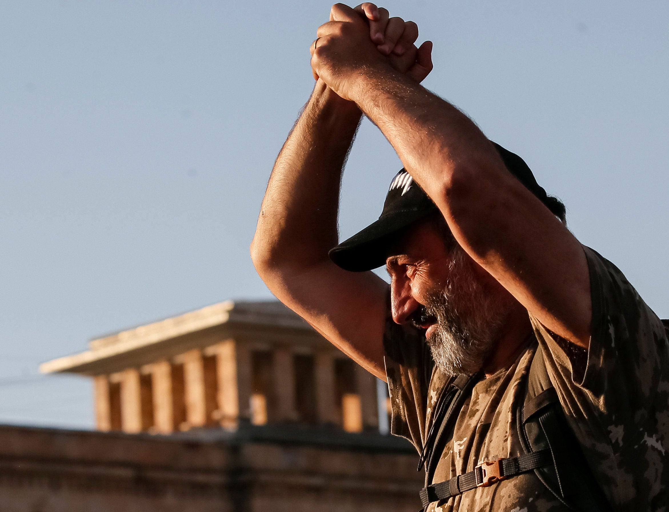 Armenian opposition leader Nikol Pashinyan gestures to his supporters