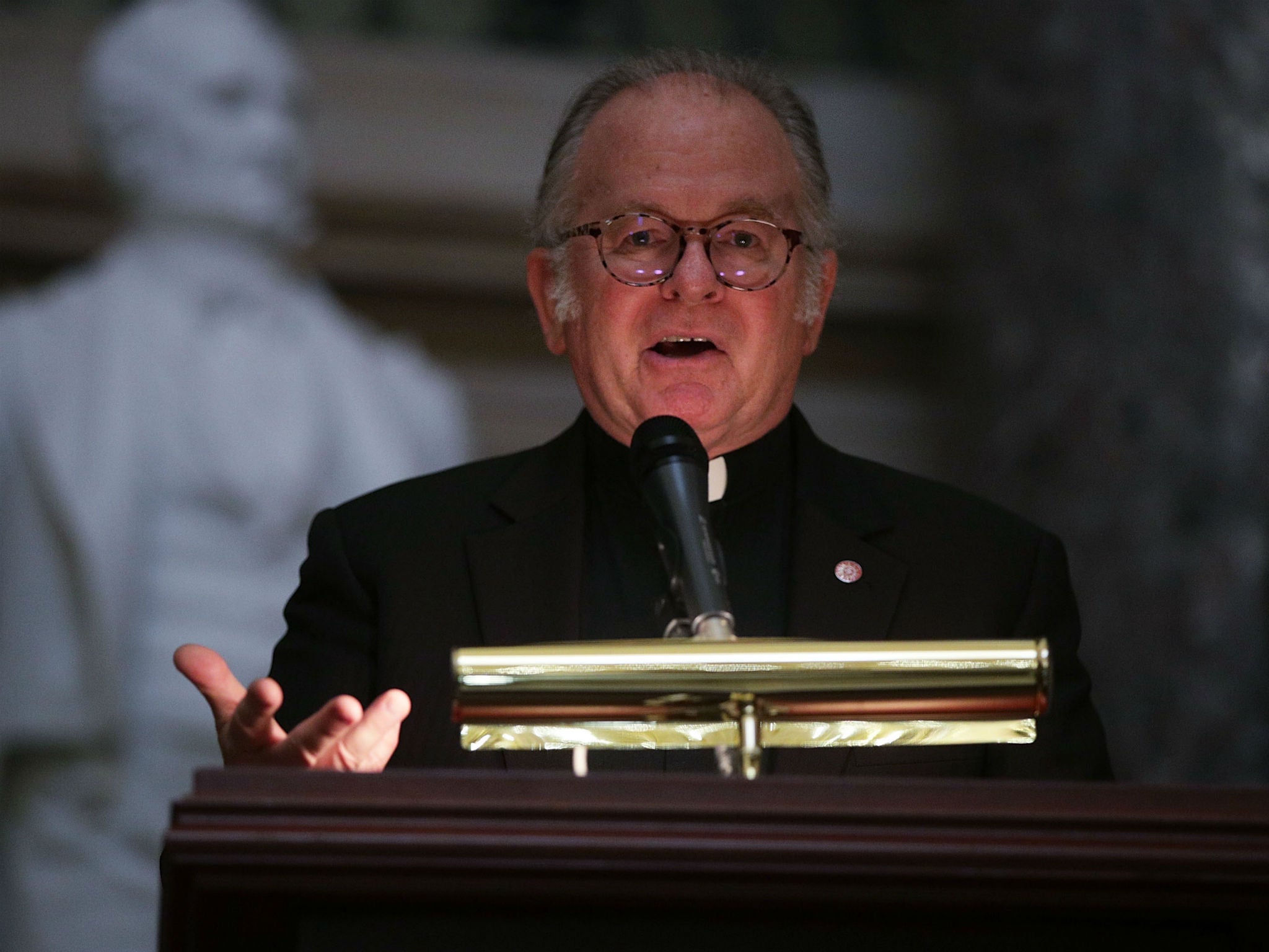 US House Chaplain Pat Conroy speaks during a memorial service in Washington, DC