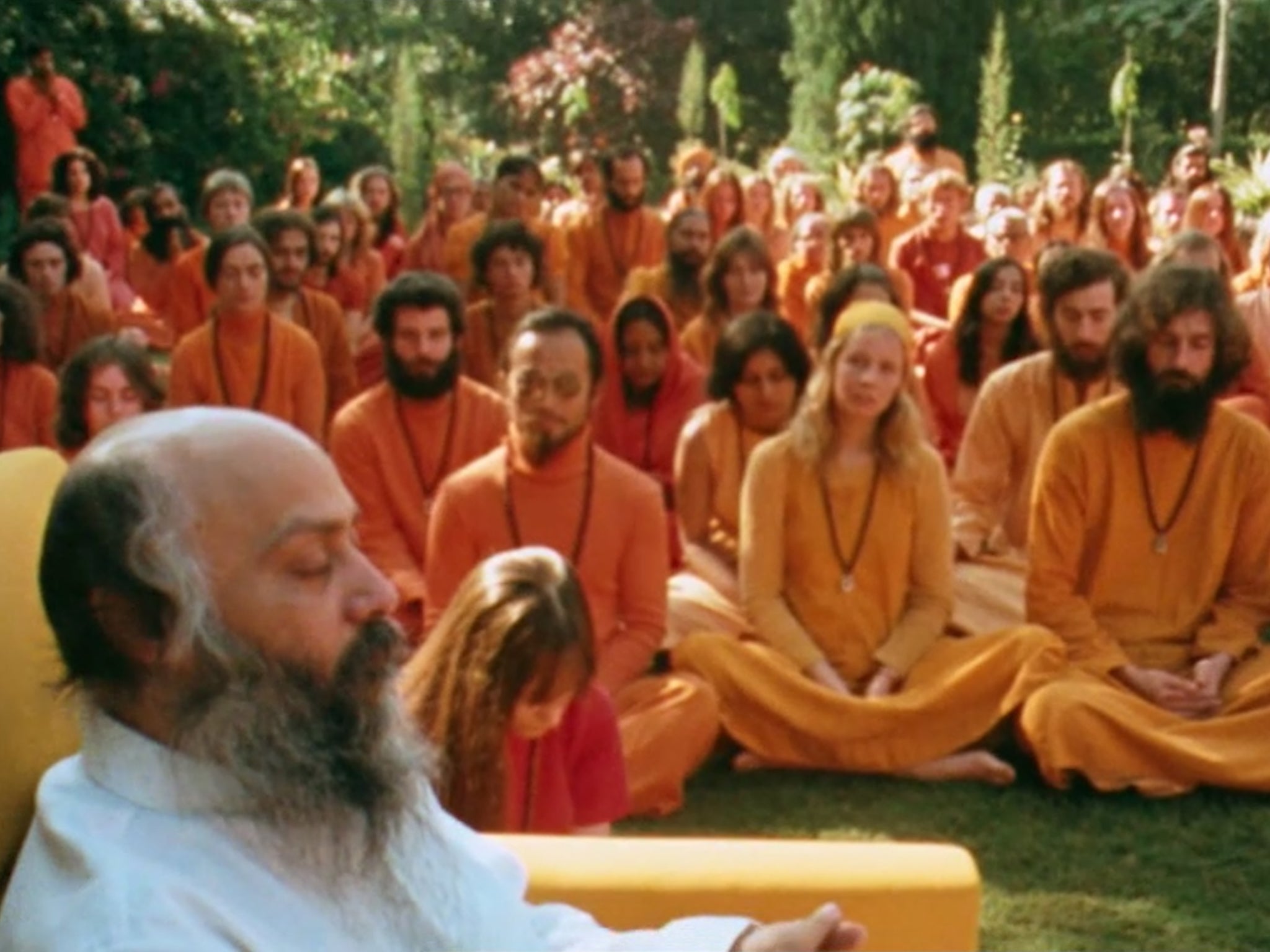 Rajneesh, also known as Osho, with his ‘Orange People’ followers