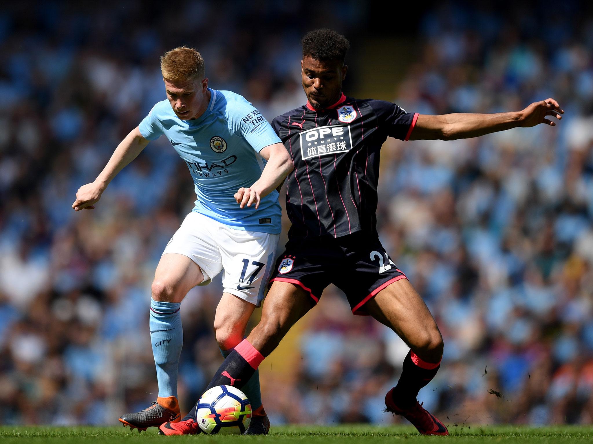 De Bruyne battles with Mounié for the ball