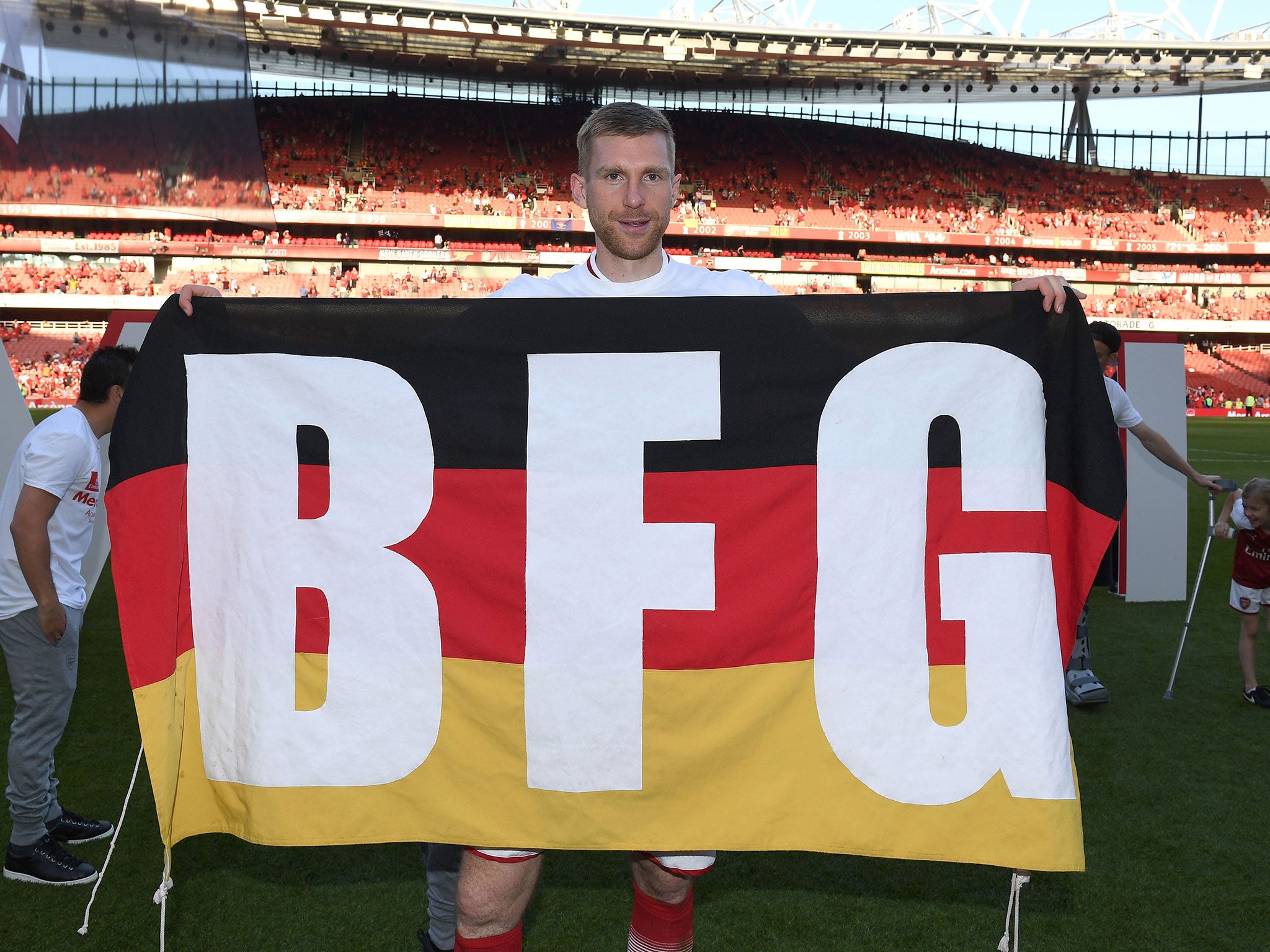 Mertesacker will remain at Arsenal away from the field