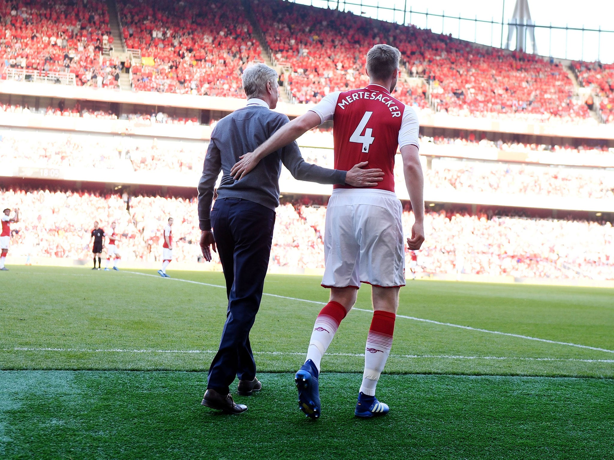 Per Mertesacker and Arsene Wenger during the German's final appearance