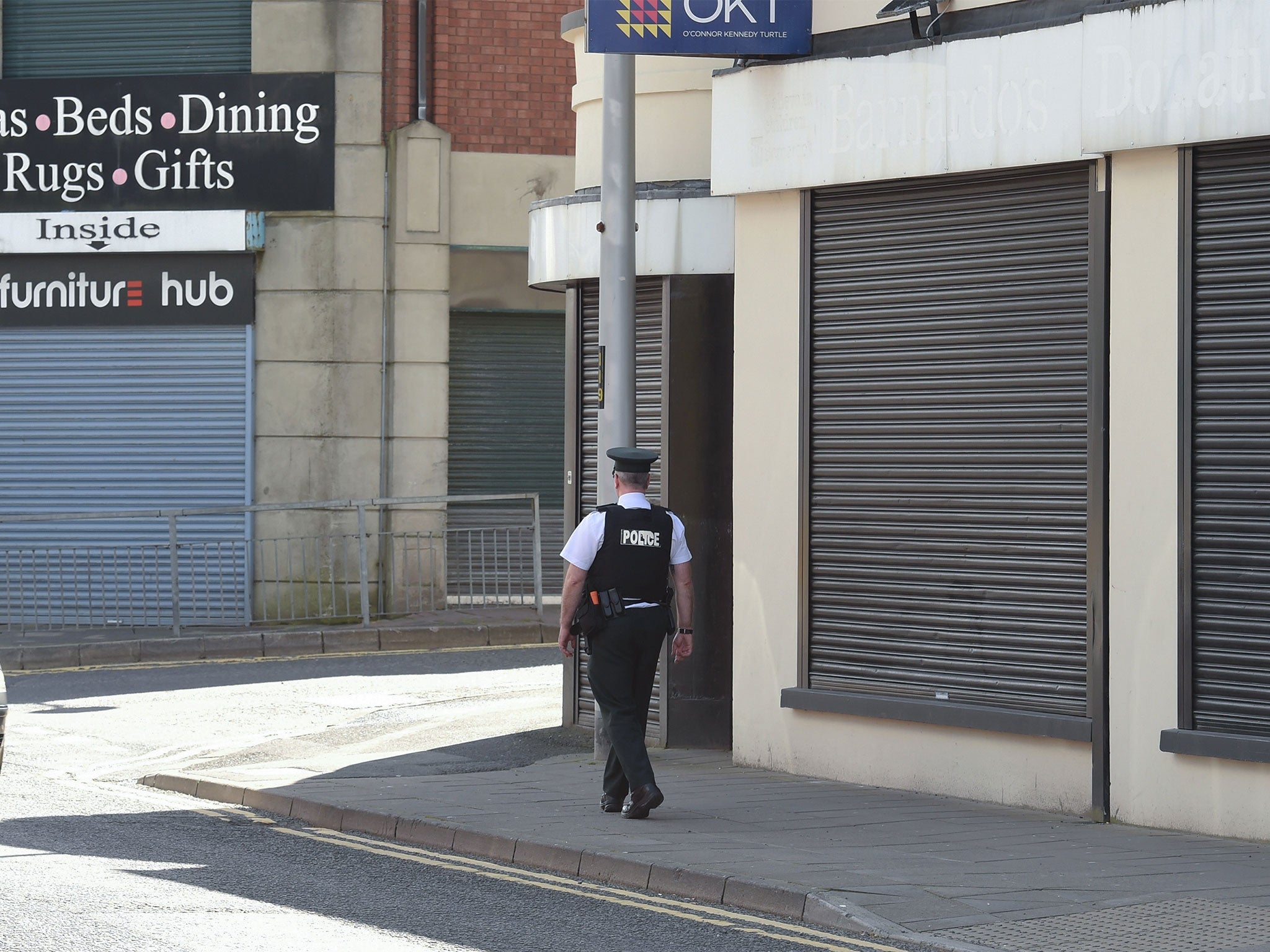 An officer on the scene of the attack in Strabane, Northern Ireland