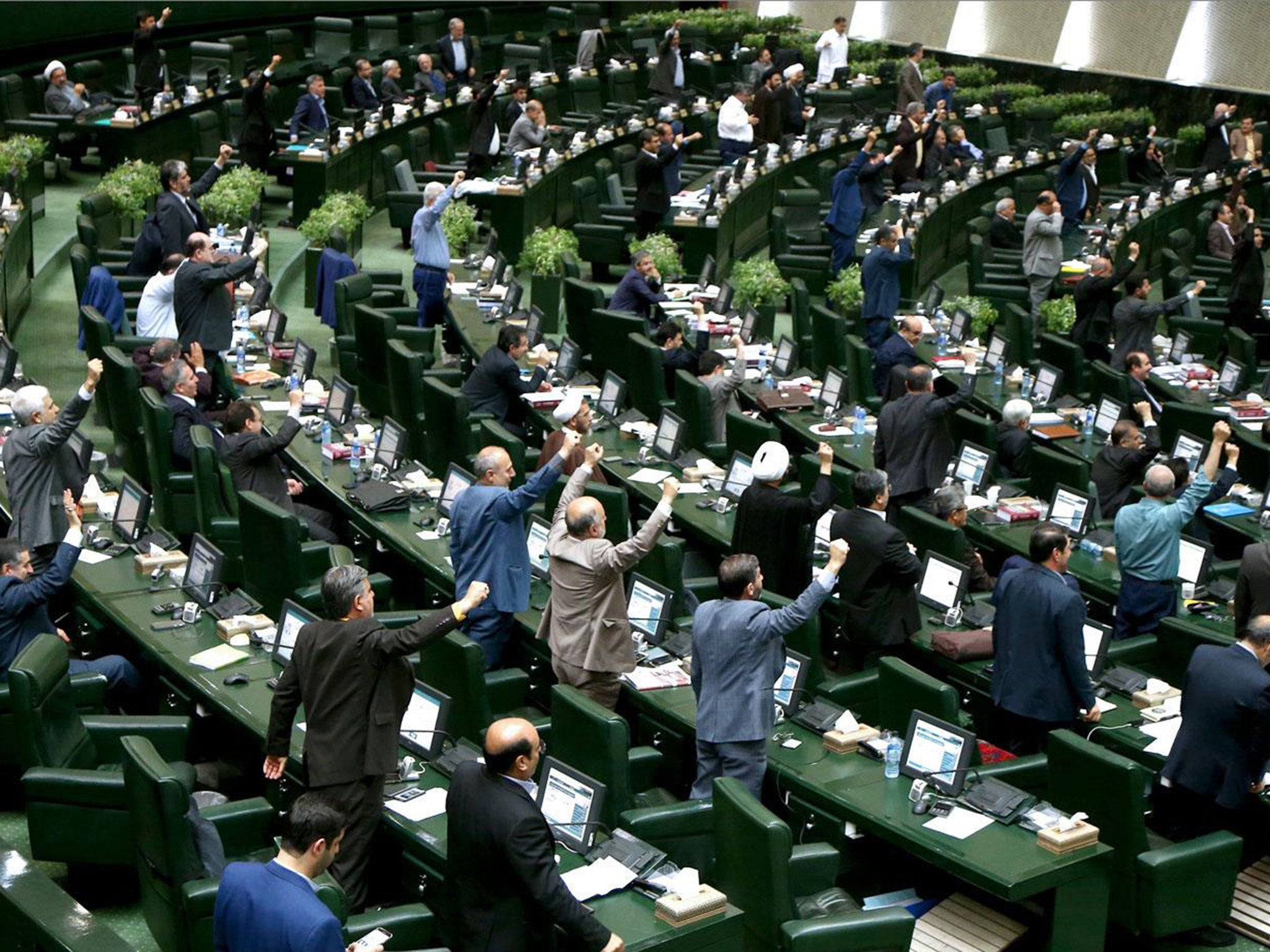 Iranian MPs stand and shout in parliament