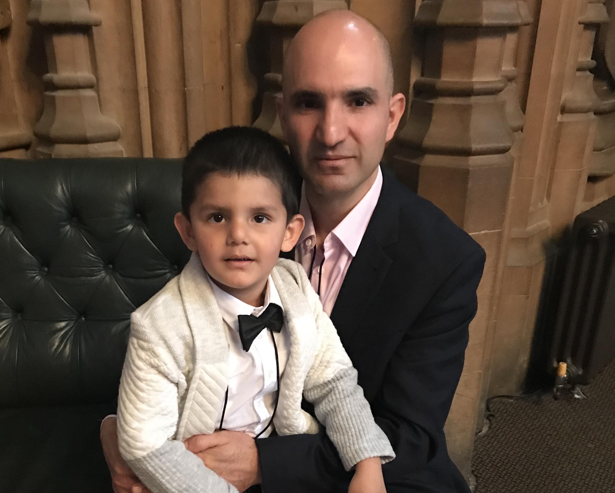 Hamid Ali Jafari with his four-year-old son Amaad following a meeting with Theresa May