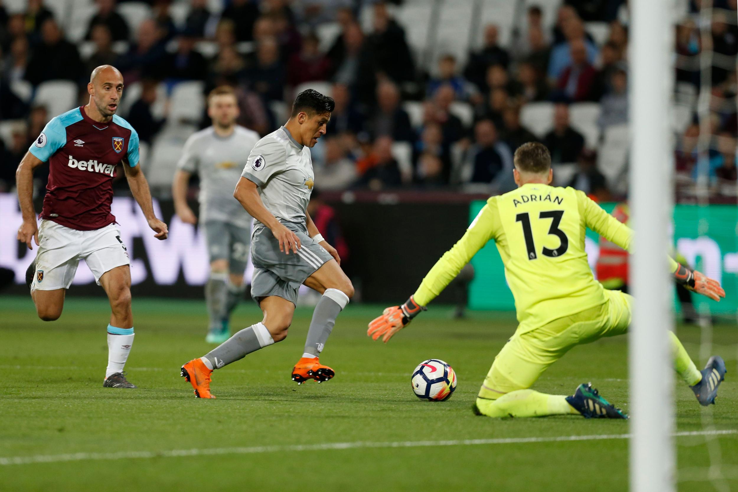 Alexis Sanchez attempts to round Adrian