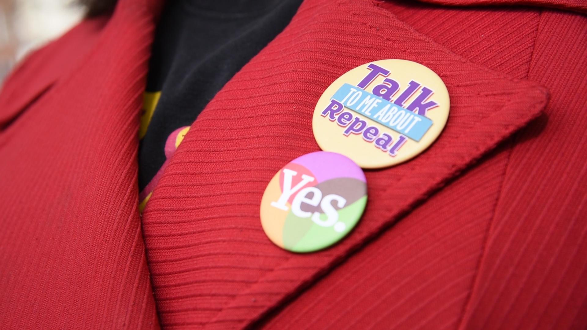 Janet wears badges to encourage others to talk to her about being pro-choice