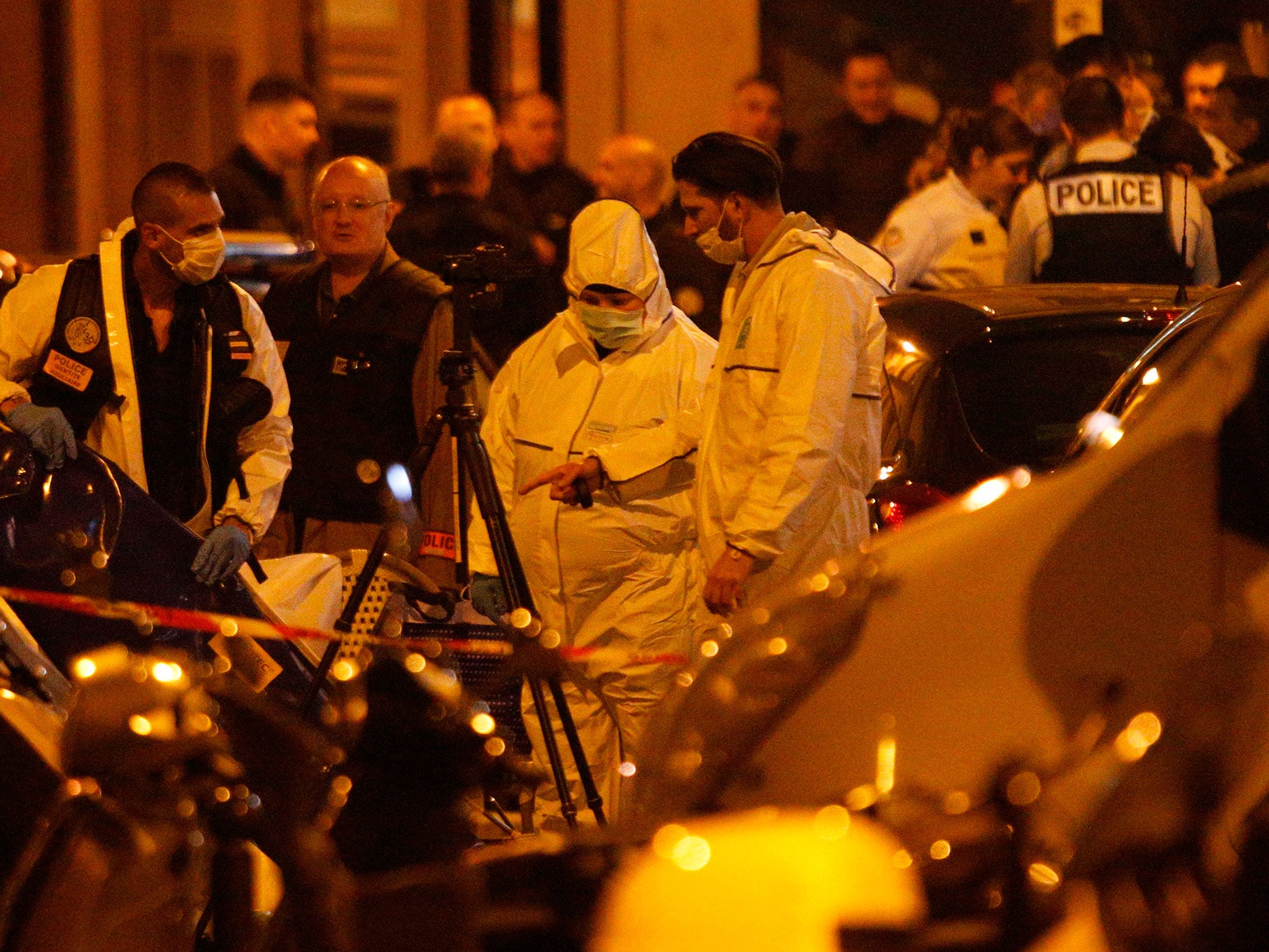 Forensic officers in Monsigny street after one person was killed and several injured by a man armed with a knife, who was shot dead by police (AFP/Getty)