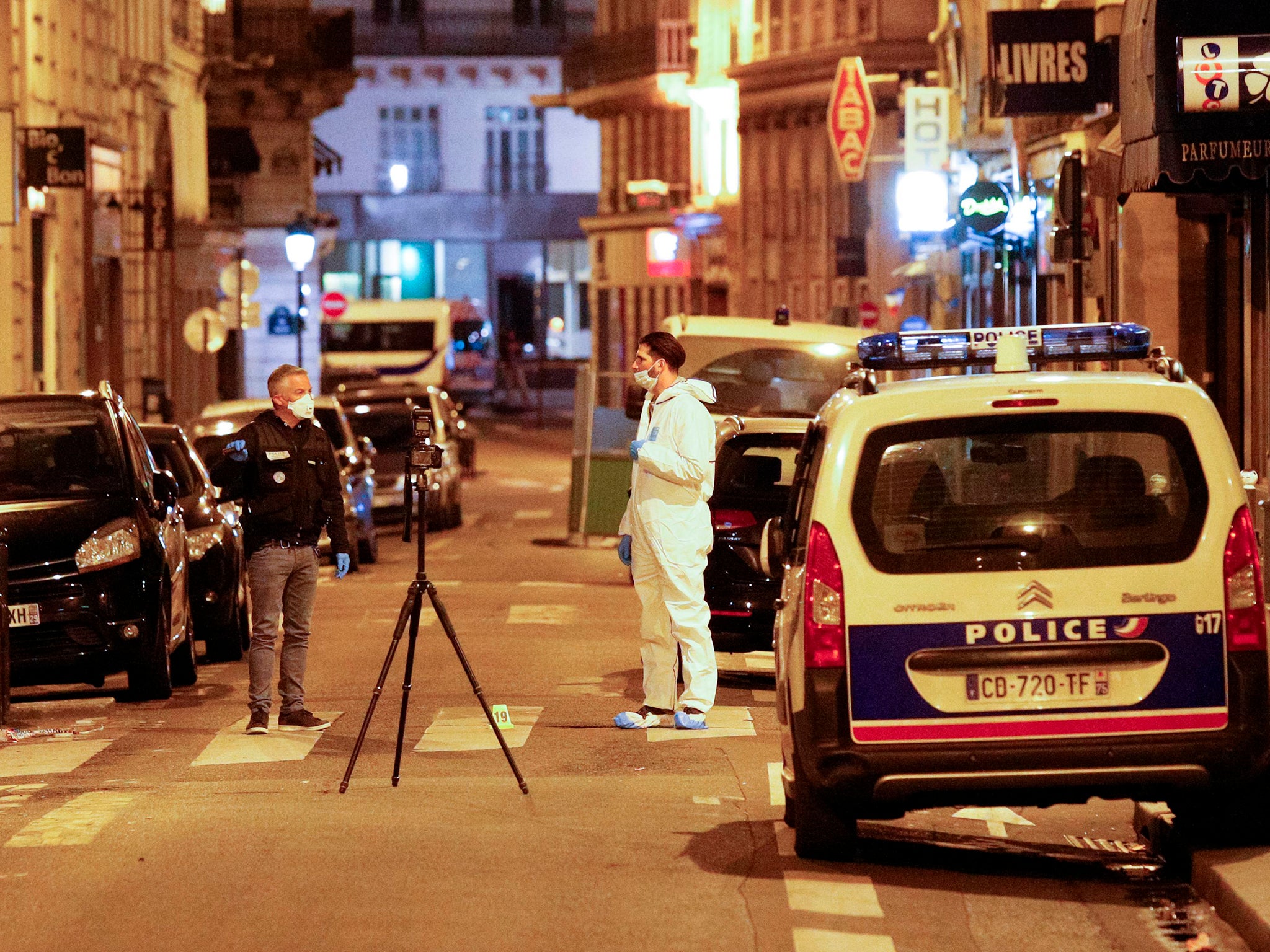 A forensic officer and French policeman on Saint Augustin street in Paris (AFP/Getty)