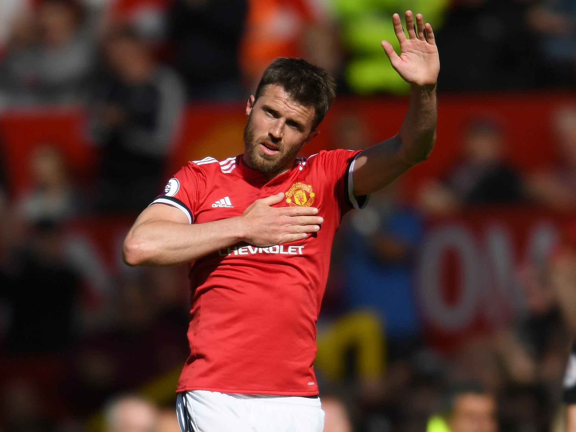 Michael Carrick waves to the United supporters