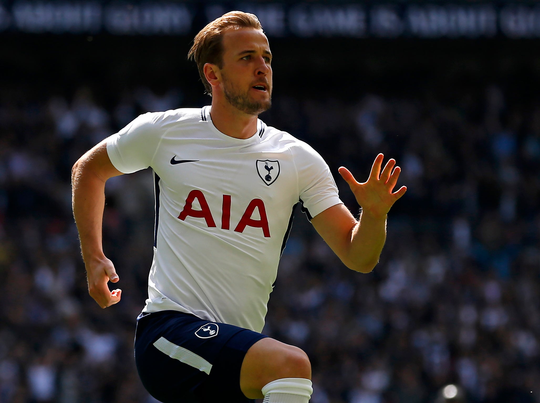 Harry Kane celebrates winning Tottenham the match