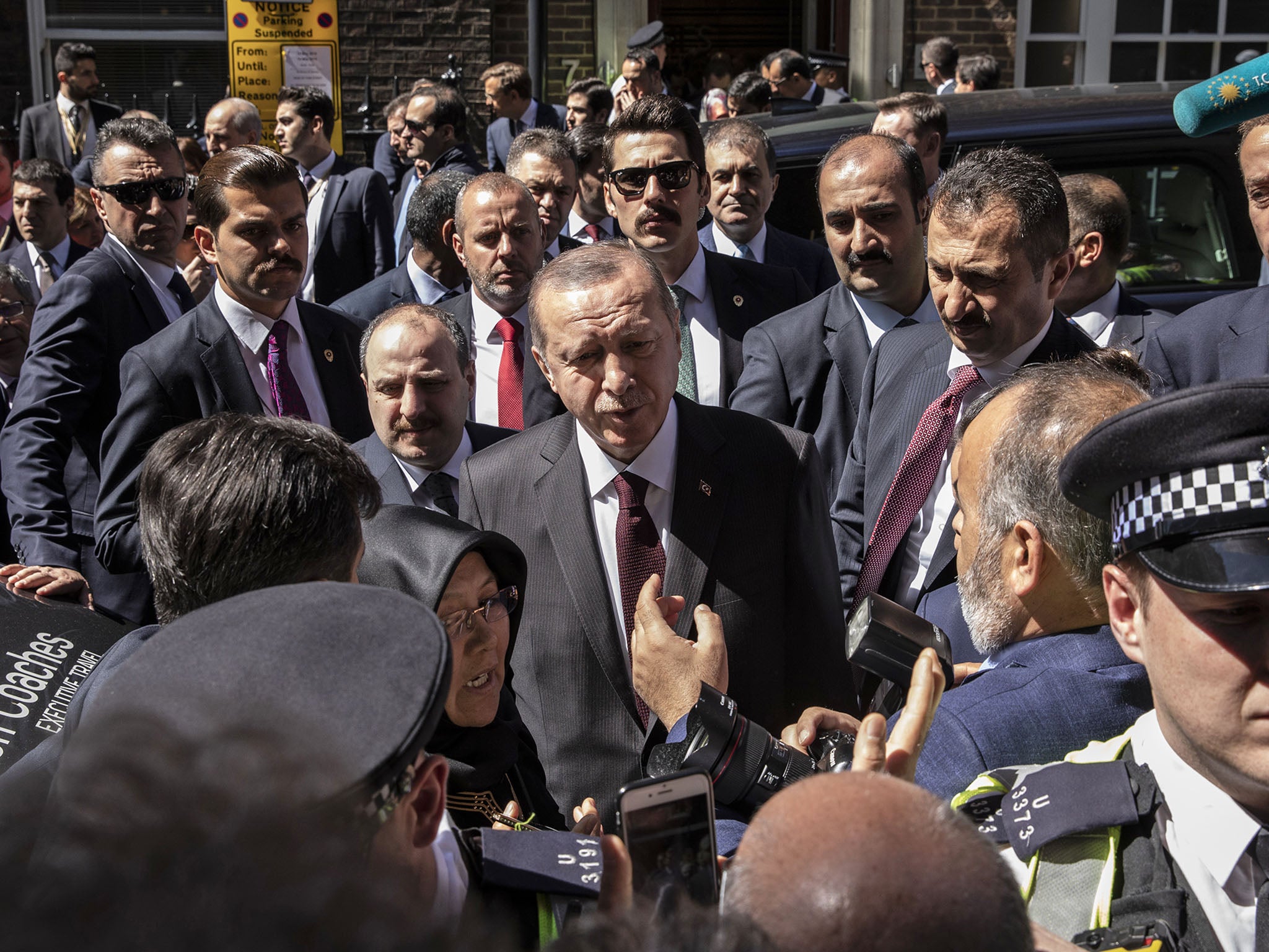 There have been protests outside Chatham House in London, where the Turkish president spoke on Monday morning