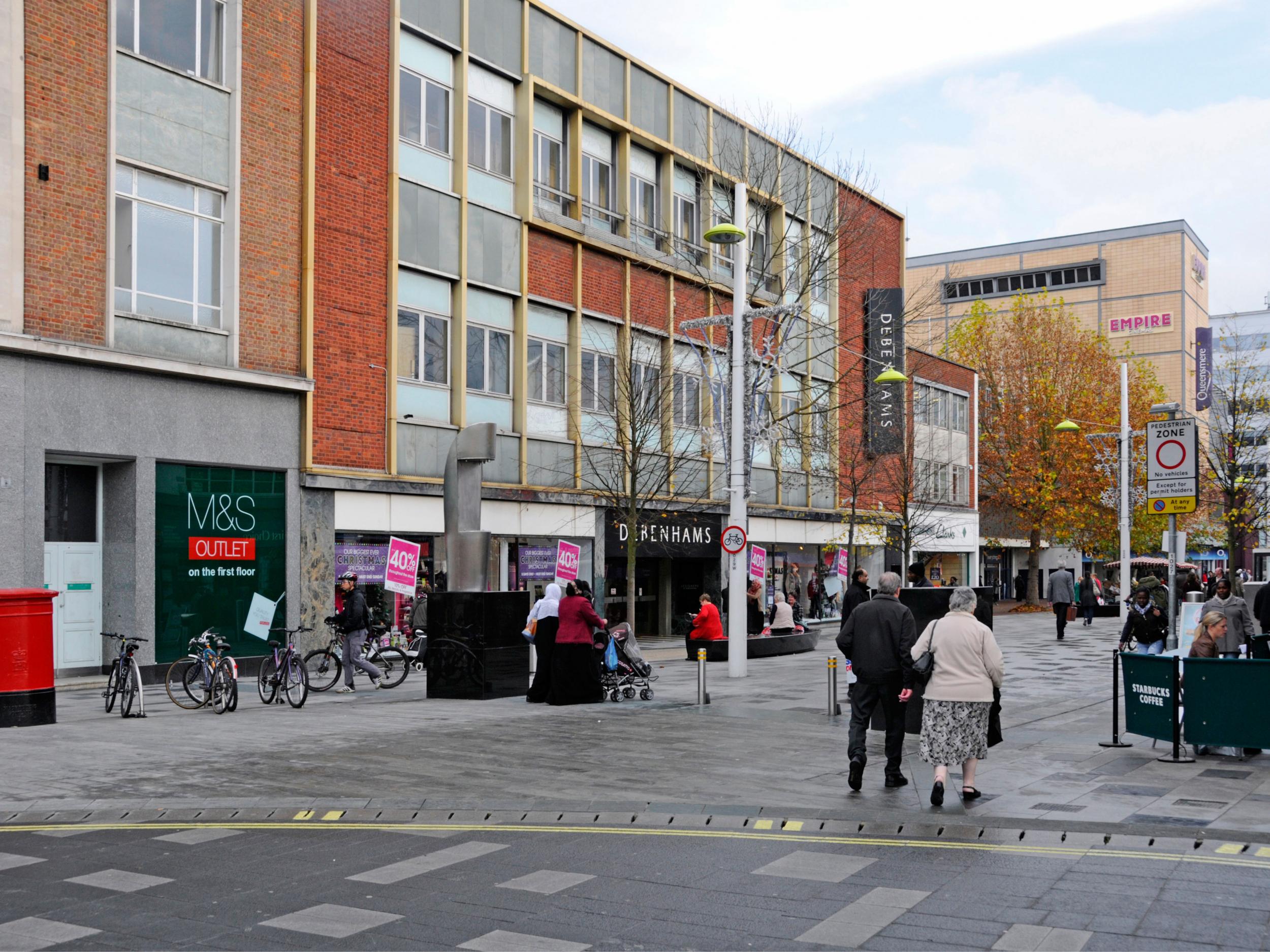 Shoppers in Slough town centre High Street