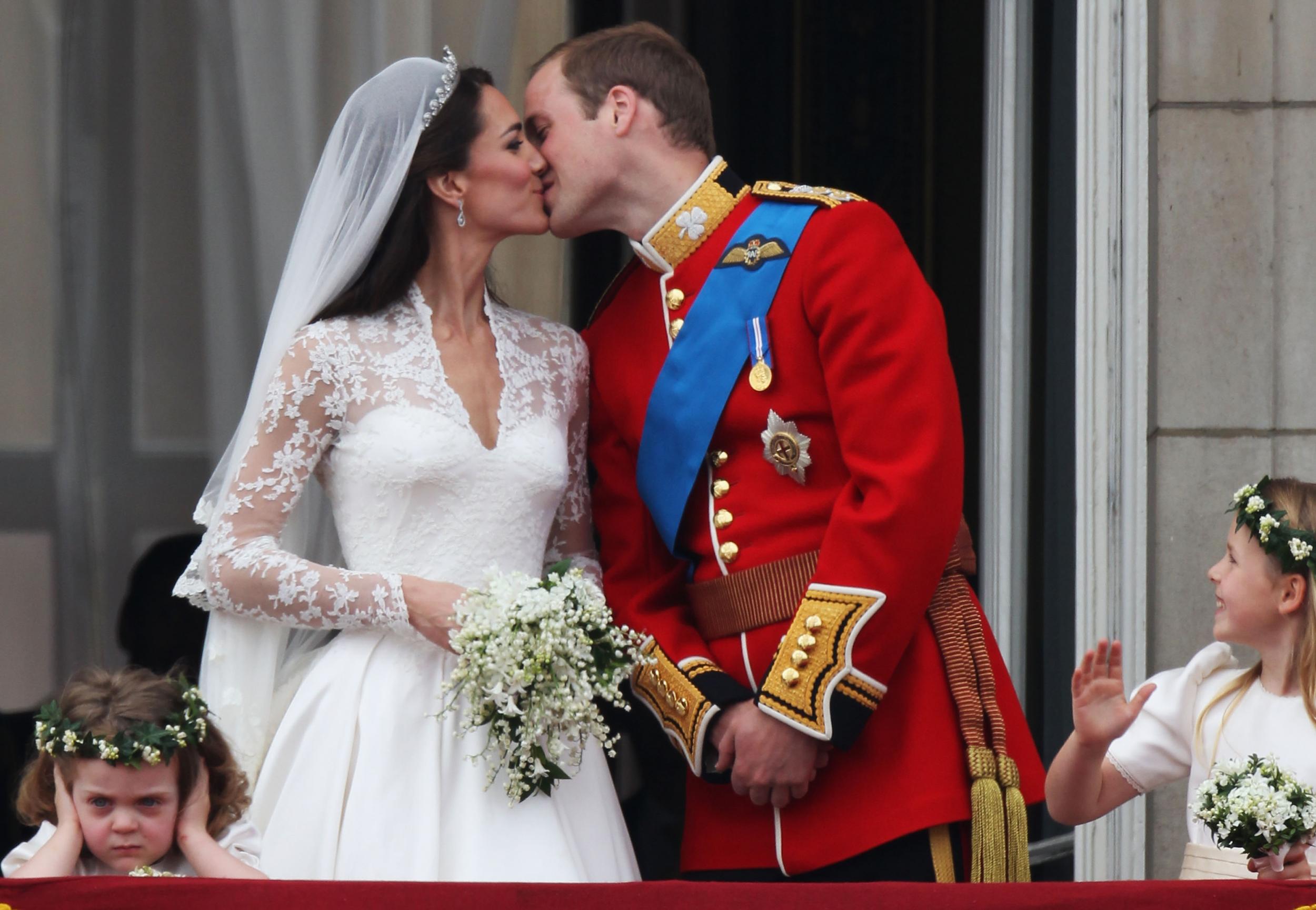 Grace van Cutsem holds her ears as the Duke and Duchess of Cambridge kiss on the balcony at Buckingham Palace on the day of their wedding in 2011.