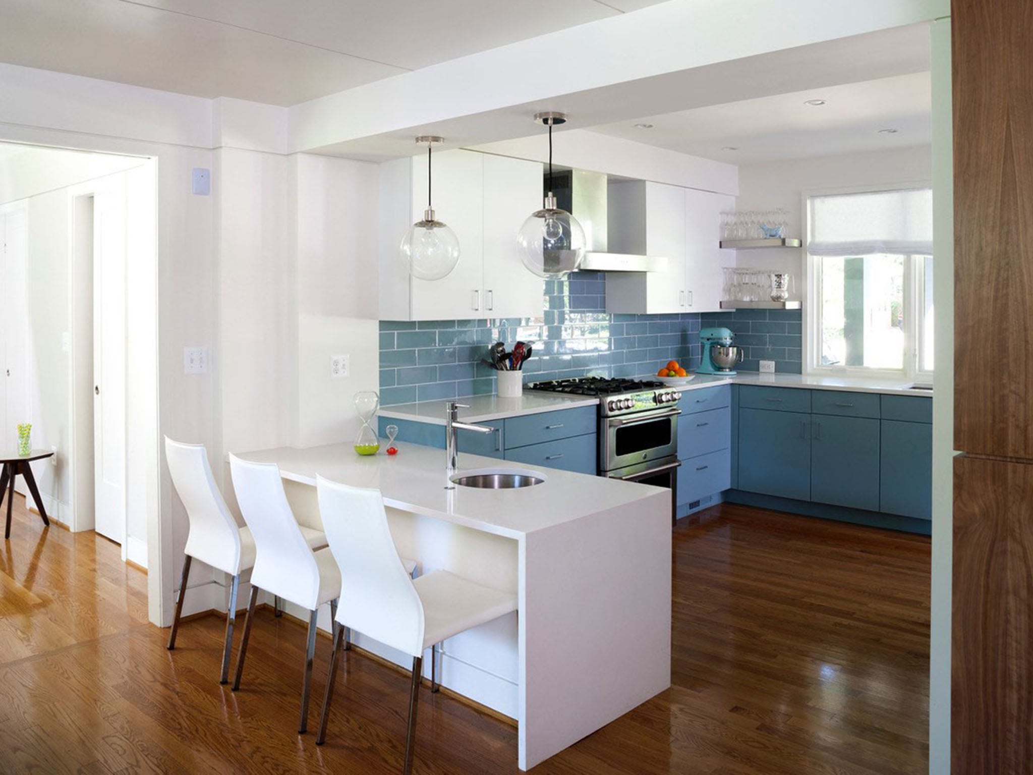 Architect Chris Snowber and designer Christie Leu were inspired to do a blue kitchen in this mid-century modern renovation