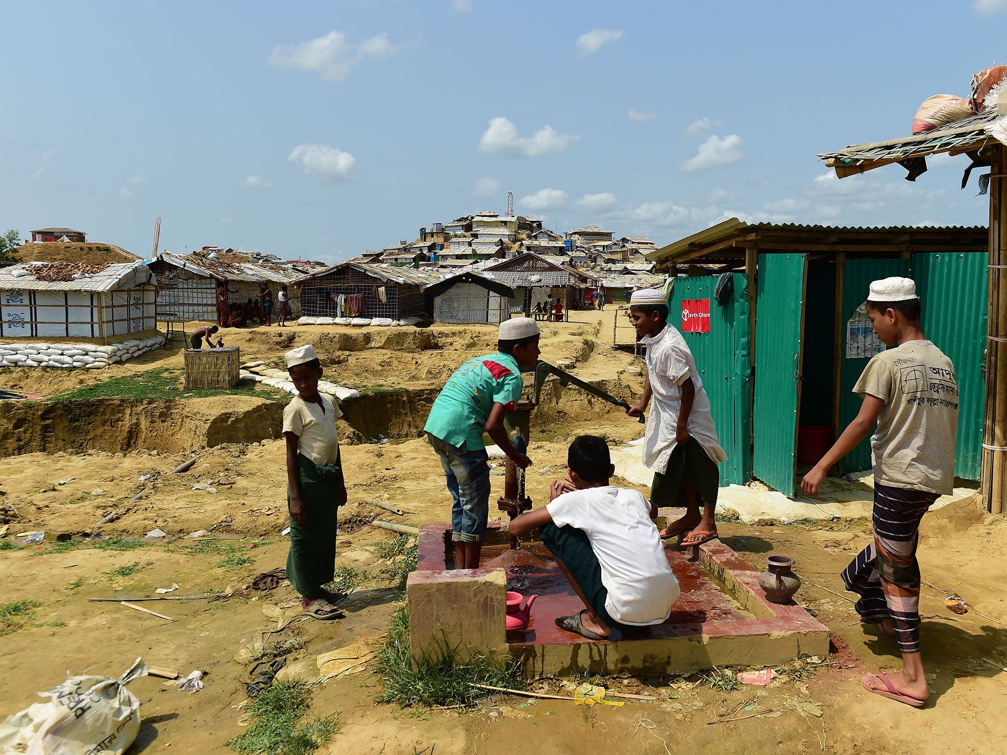 Rohingya men prepare to make an offering for afternoon prayers at a refugee camp in Ukhia, Cox’s Bazar