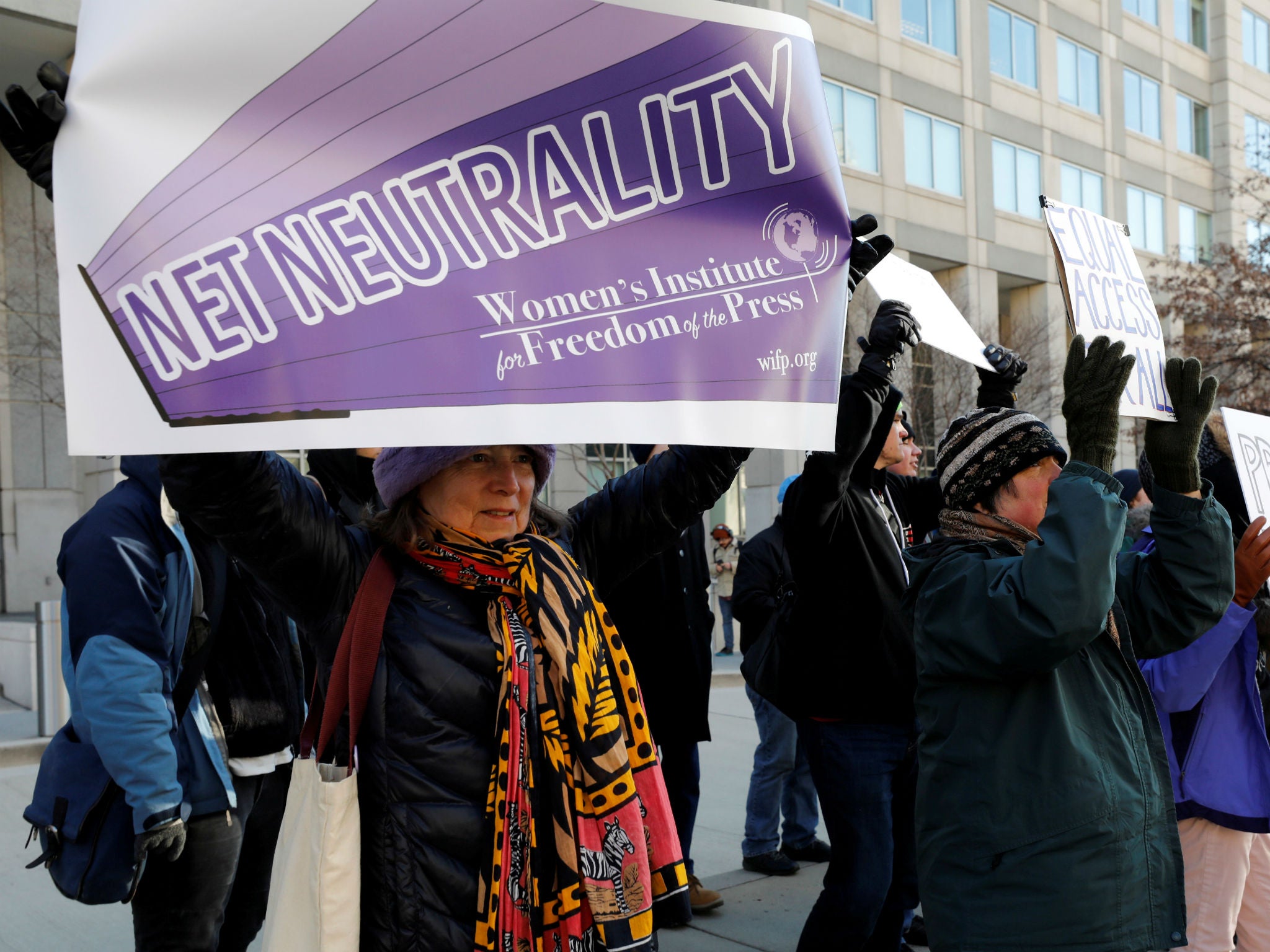 Net neutrality advocates rallied in front of the Federal Communications Commission ahead of the vote repealing so-called net neutrality rules