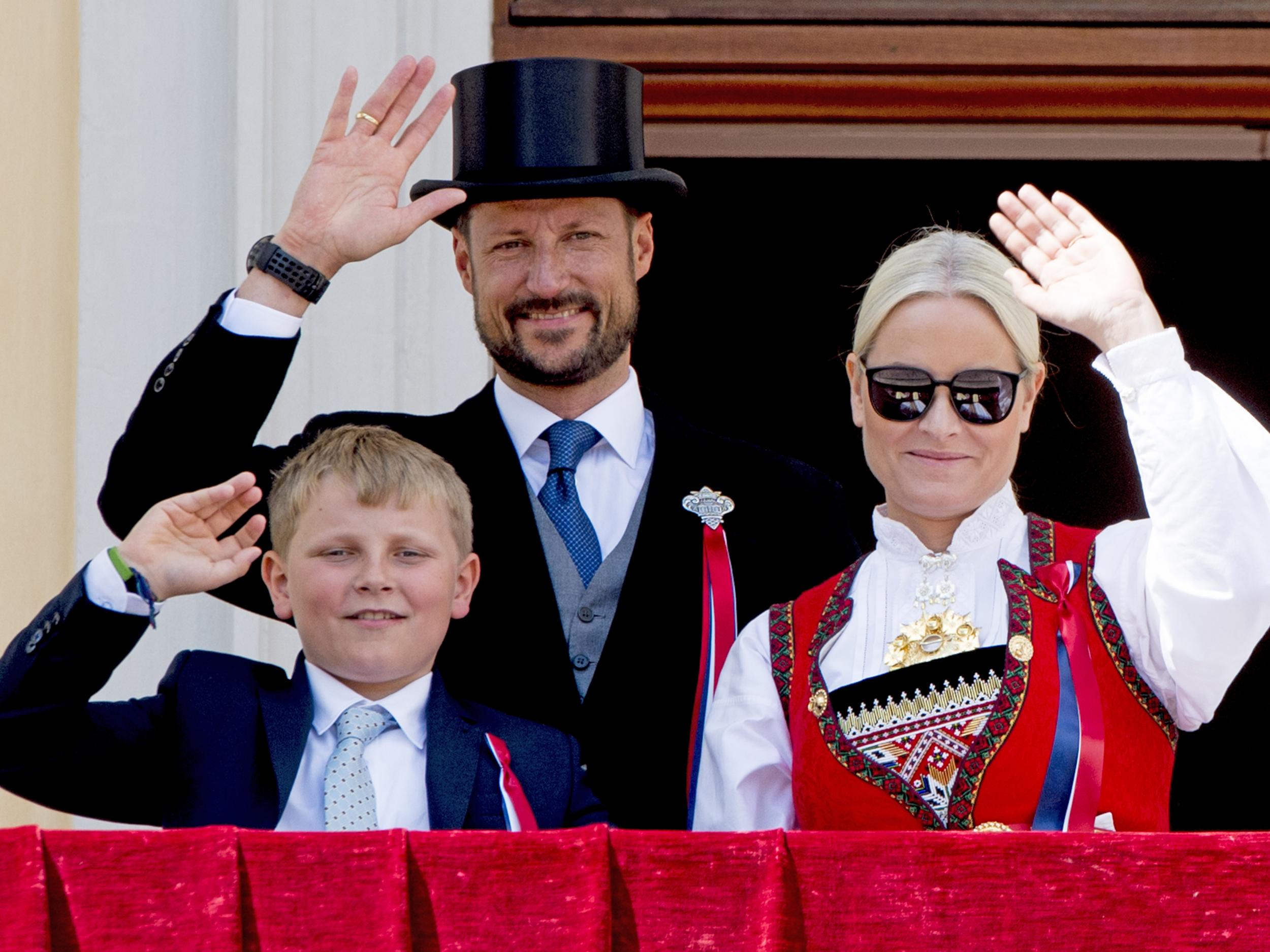 Crown Princess Mette-Marit, Crown Prince Haakon and Prince Sverre Magnus on waving to the crowds on Constitution Day