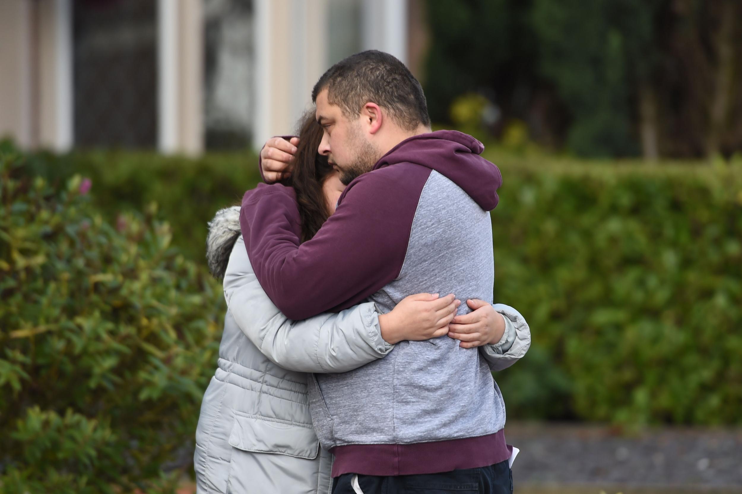 Reece Platt-May hugs his sister Tia Fletcher following the death of his sons Corey and Casper