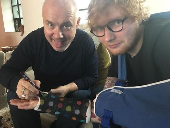 Ed Sheeran poses with artist Damien Hirst after fracturing his wrist