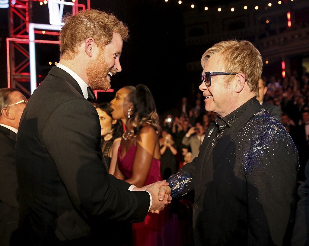 Prince Harry greets Sir Elton John at the 2015 Royal Variety Performance