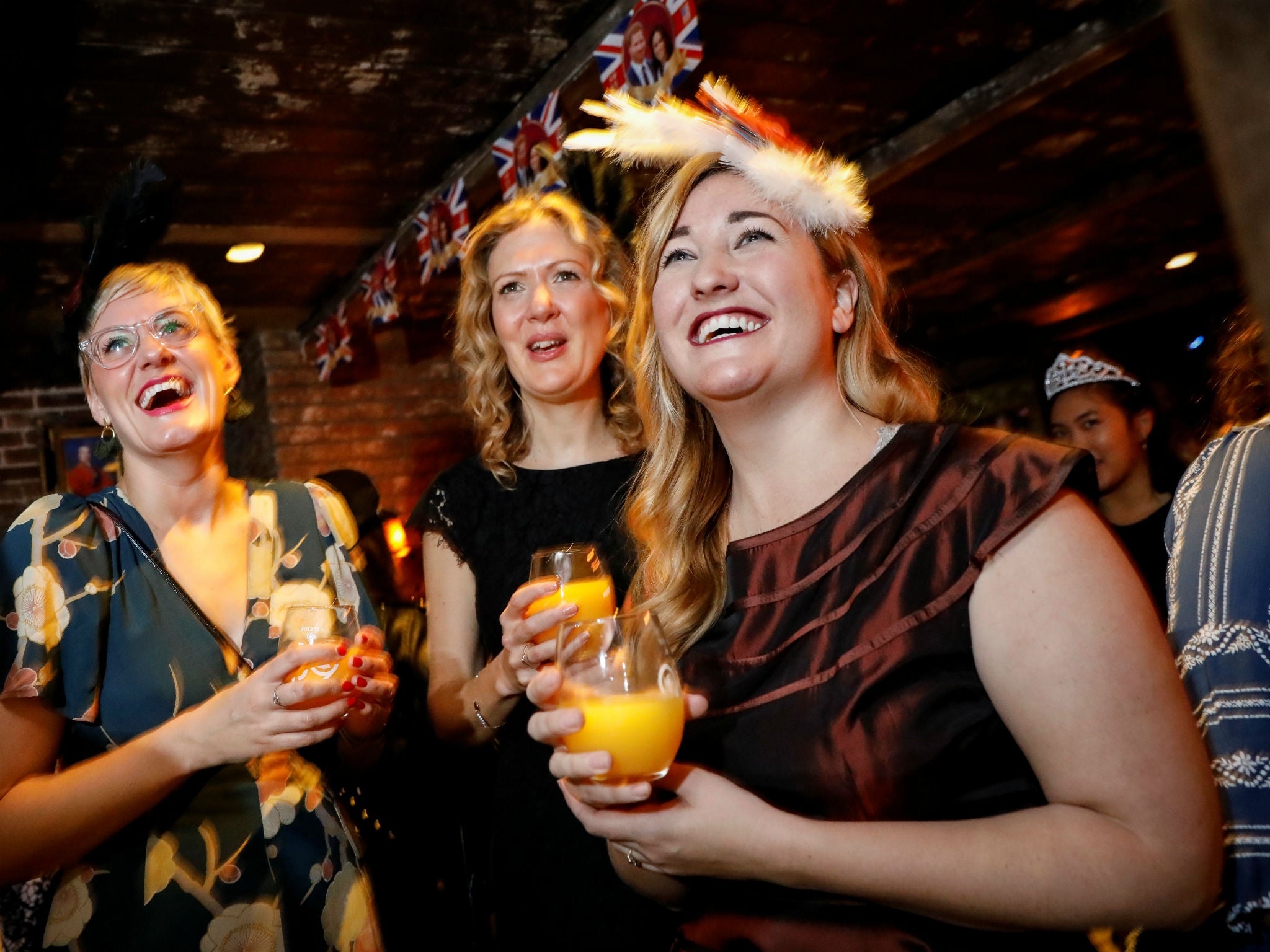 Royal wedding fans take in the ceremony at the Churchill Tavern in New York
