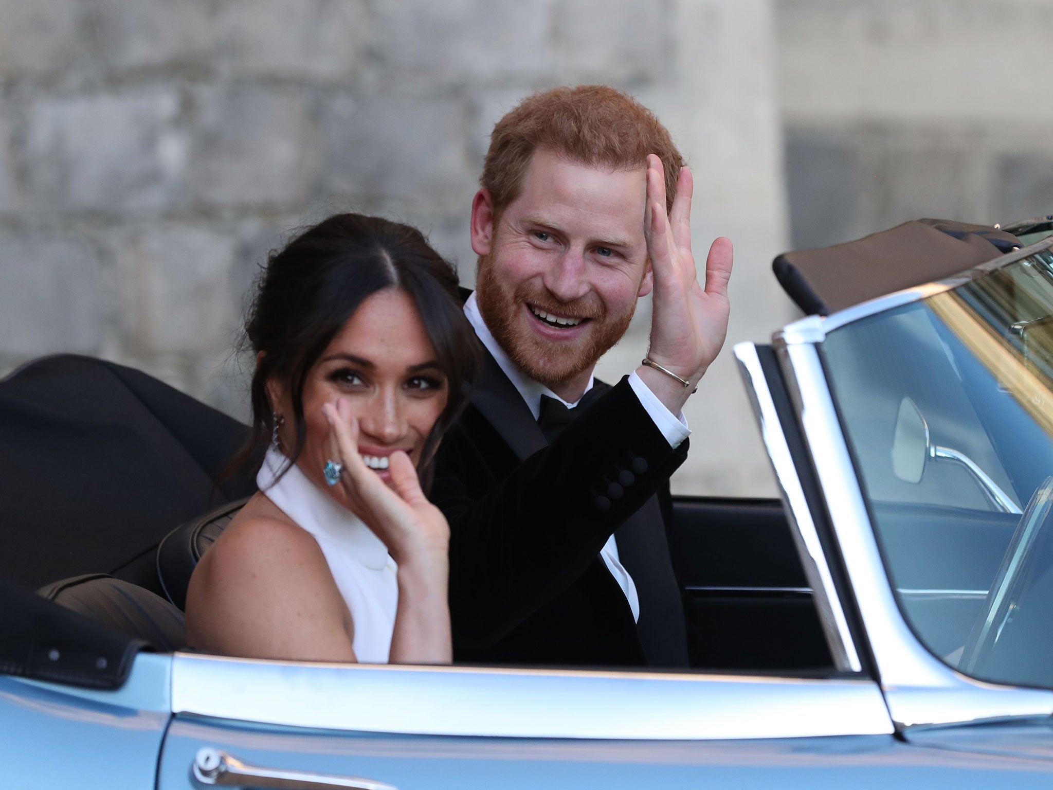 Harry and Meghan in an E-Type Jaguar after their wedding