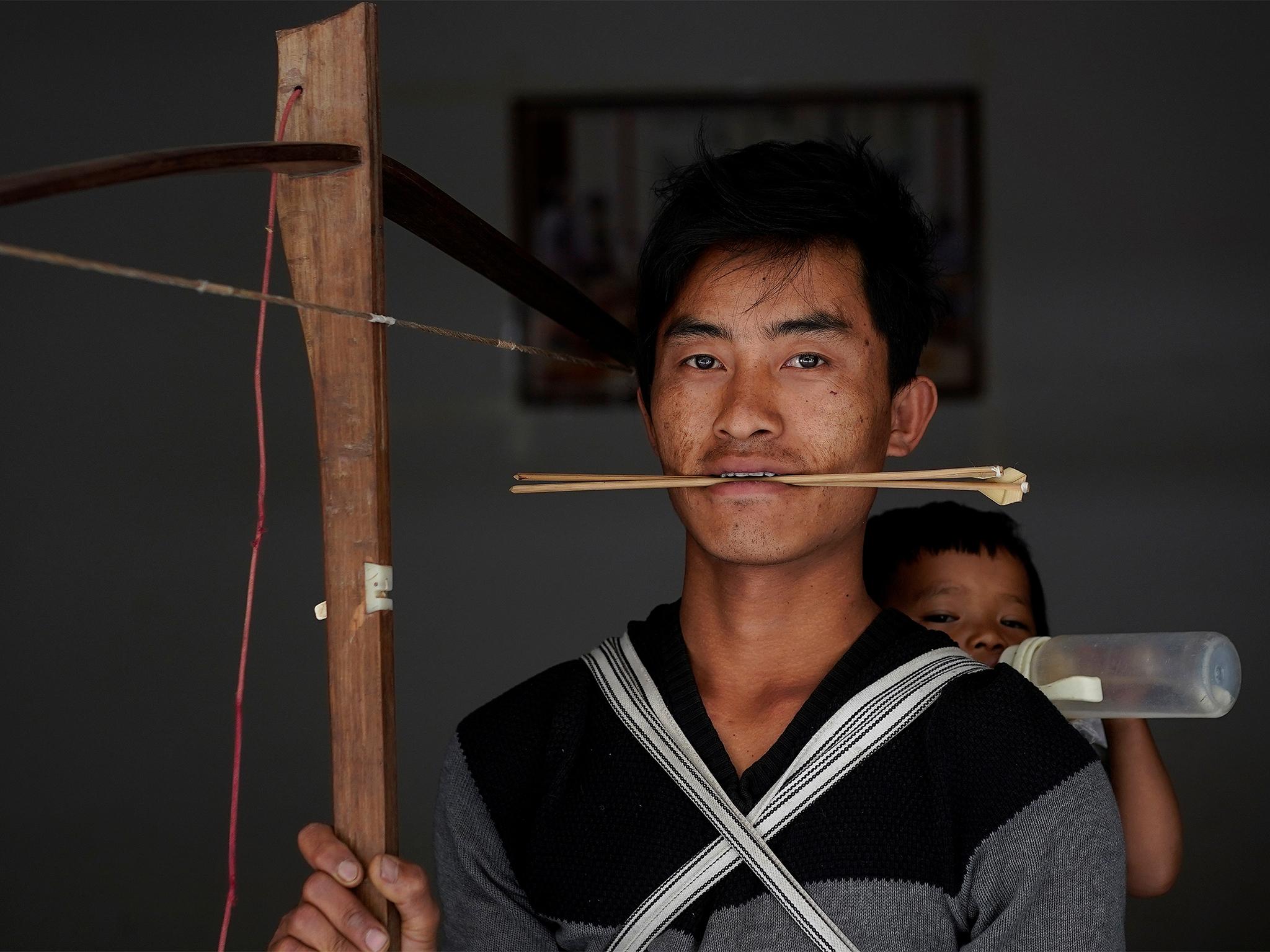 Secret weapons: Zhang and other tribe members are aiming to save the tradition, which dates back to 200BC, by promoting it as a sport