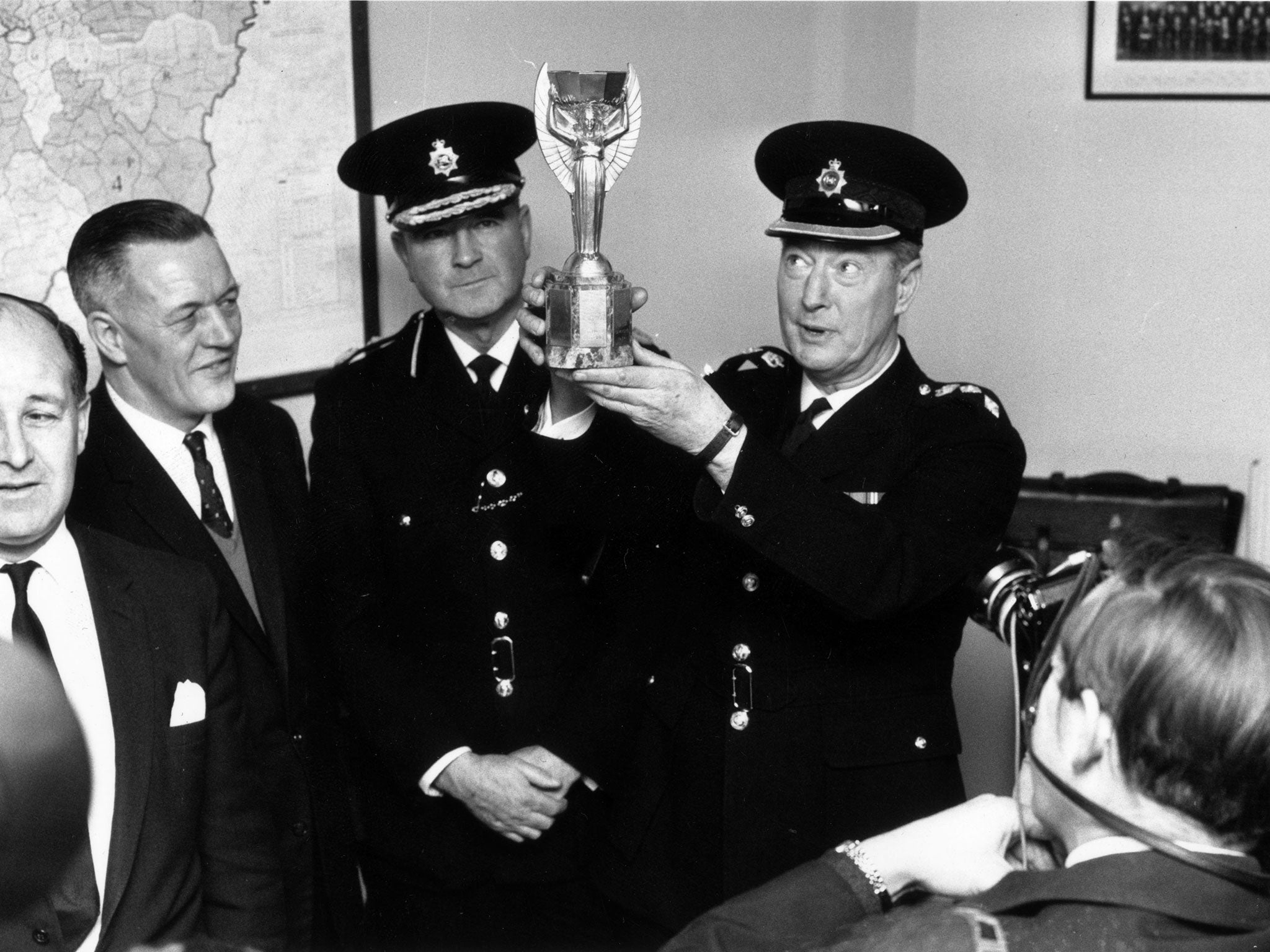 London police with the Jules Rimet trophy after it was found by Pickles the dog following its initial disappearance