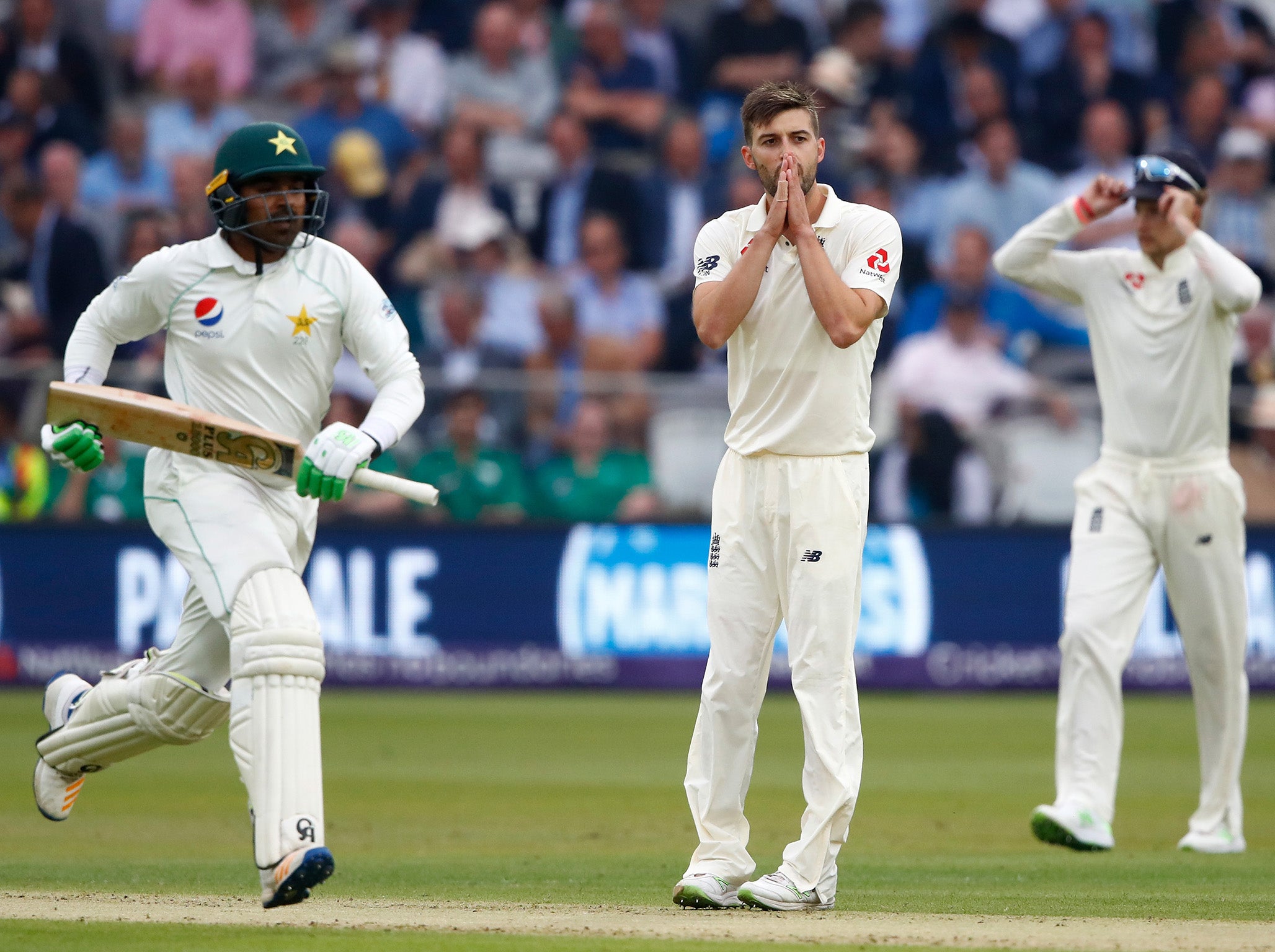 Mark Wood reacts after a dropped opportunity