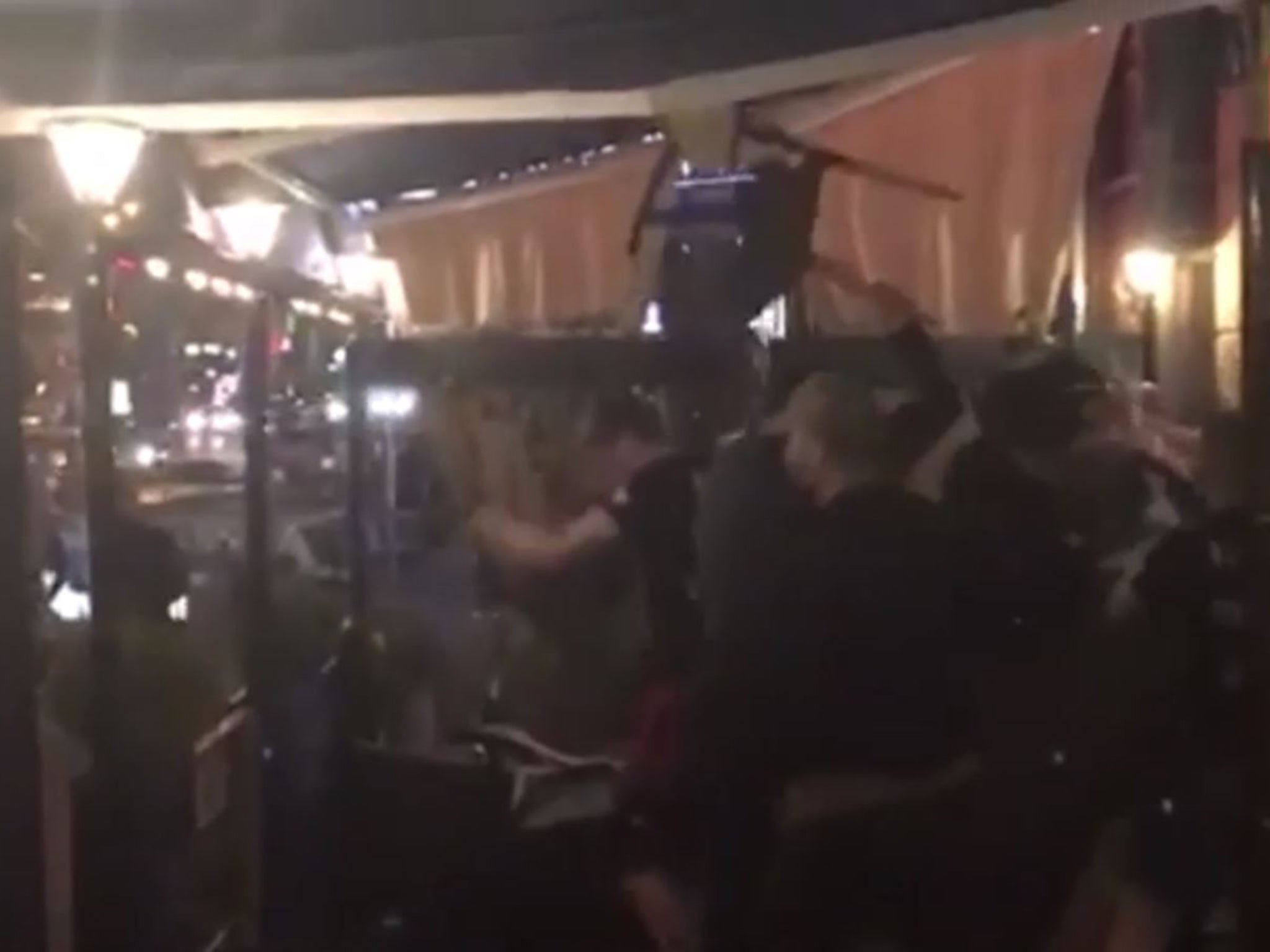 A video appears to show a group of hooligans attacking Liverpool supporters in a Kiev restaurant