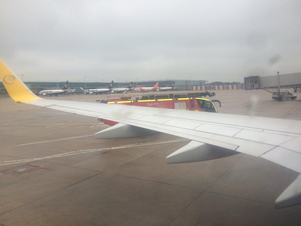 A fire engine escorting a Primera Air Boeing 737 back to the terminal at Stansted after it collided with a Ryanair aircraft