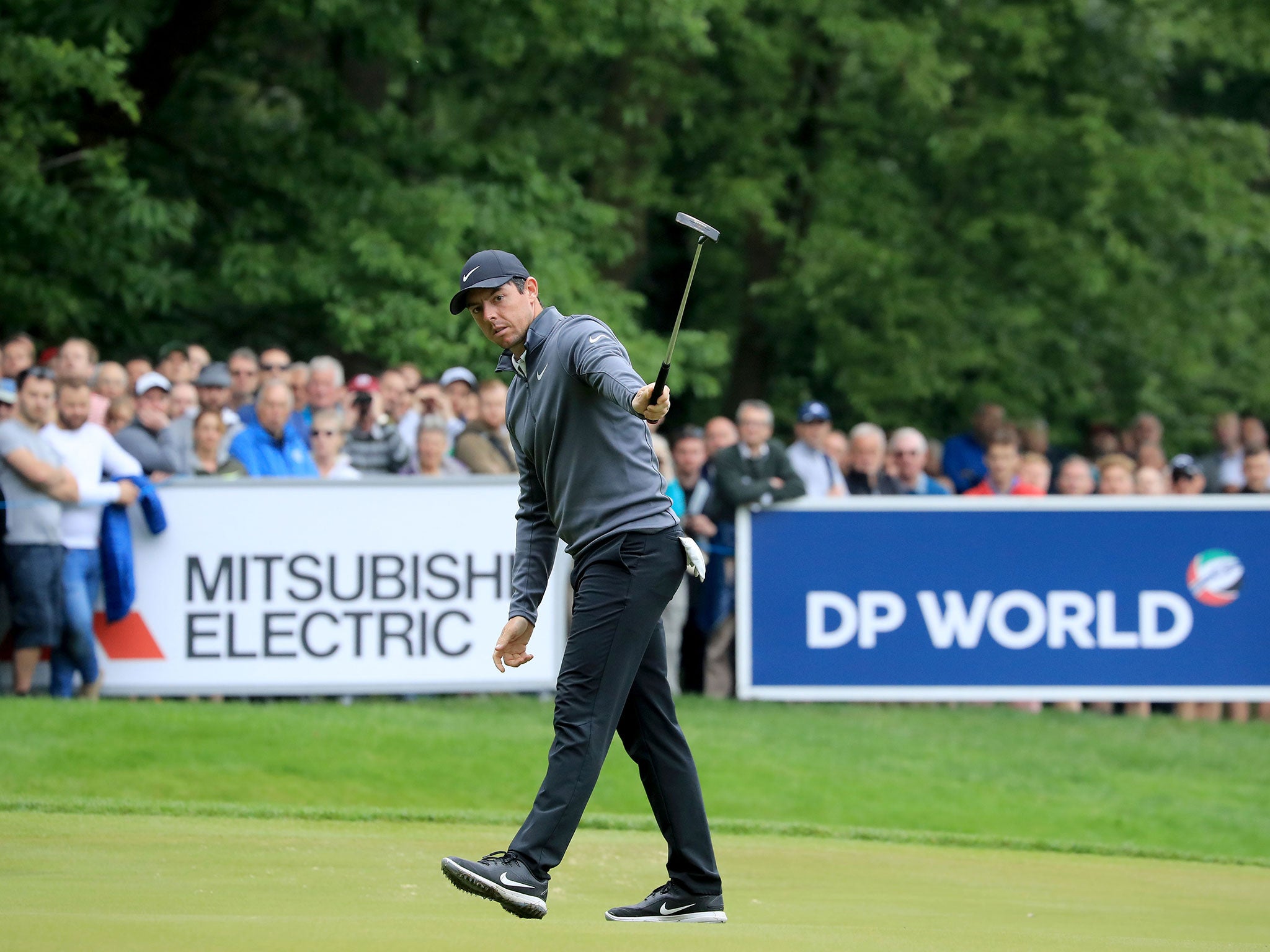 The four-time major winner holes a putt for birdie on the 15th hole