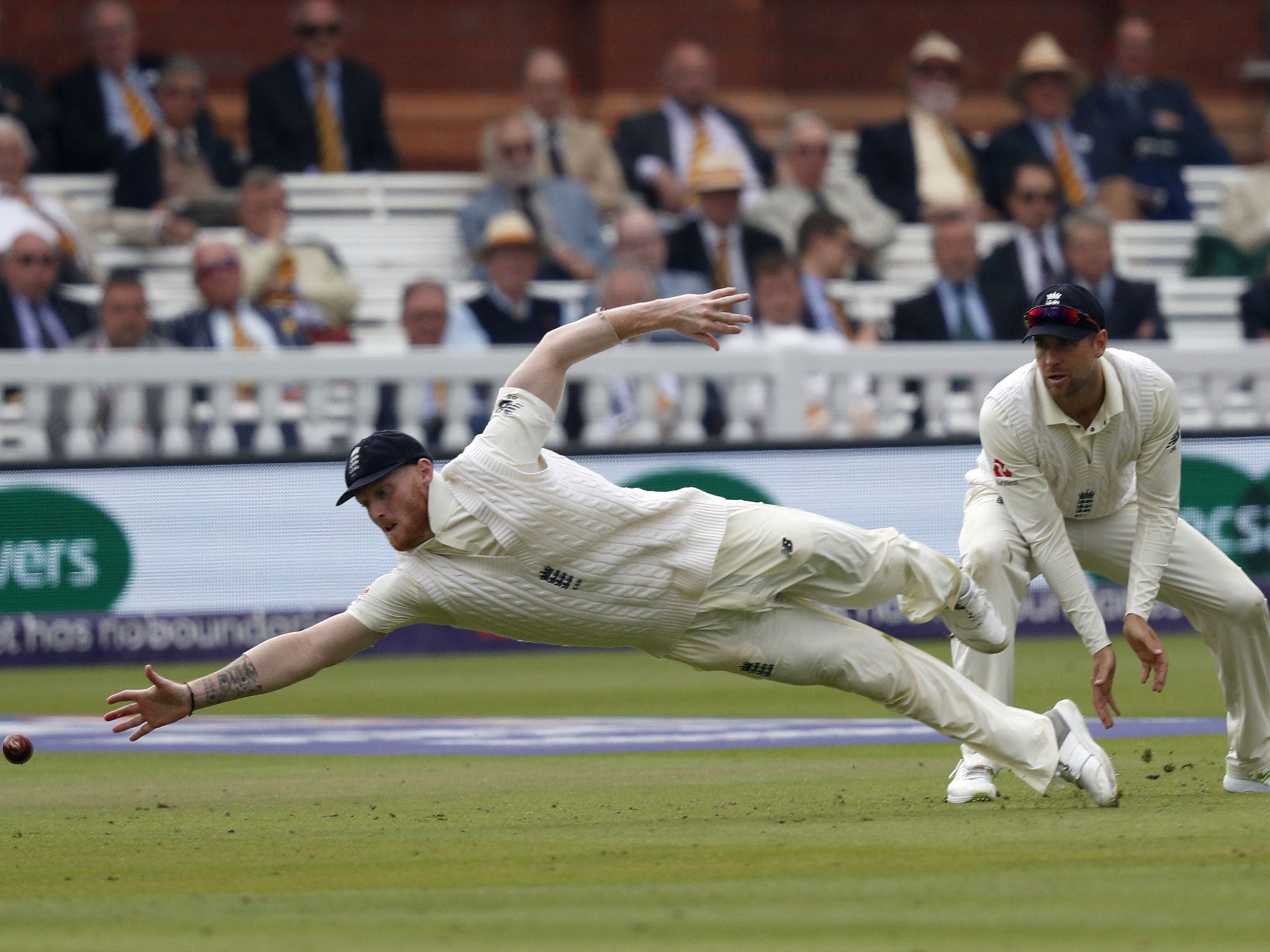 Ben Stokes dives for the ball in the slips