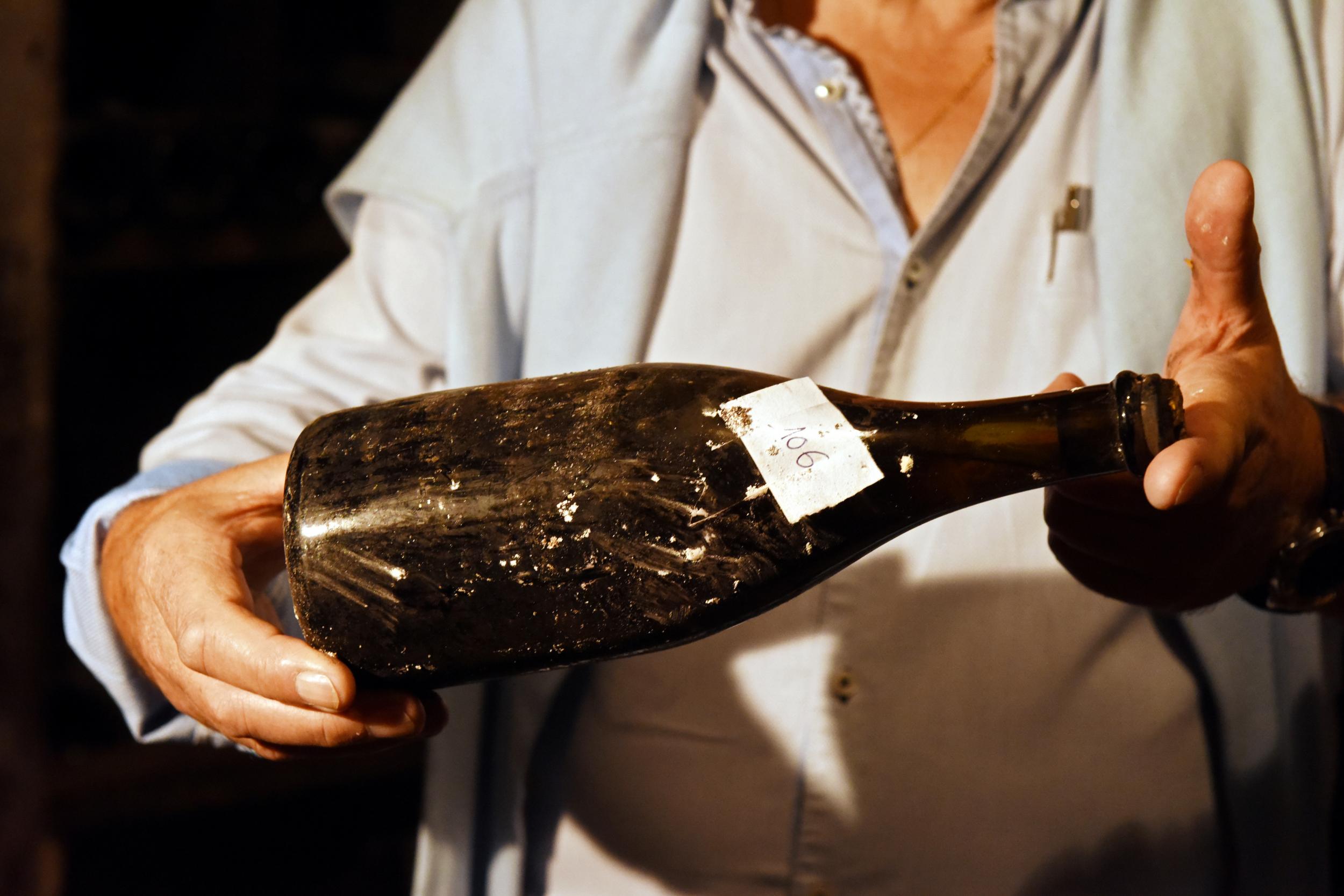 One of three bottles of vin jaune "yellow wine" from 1774, is presented