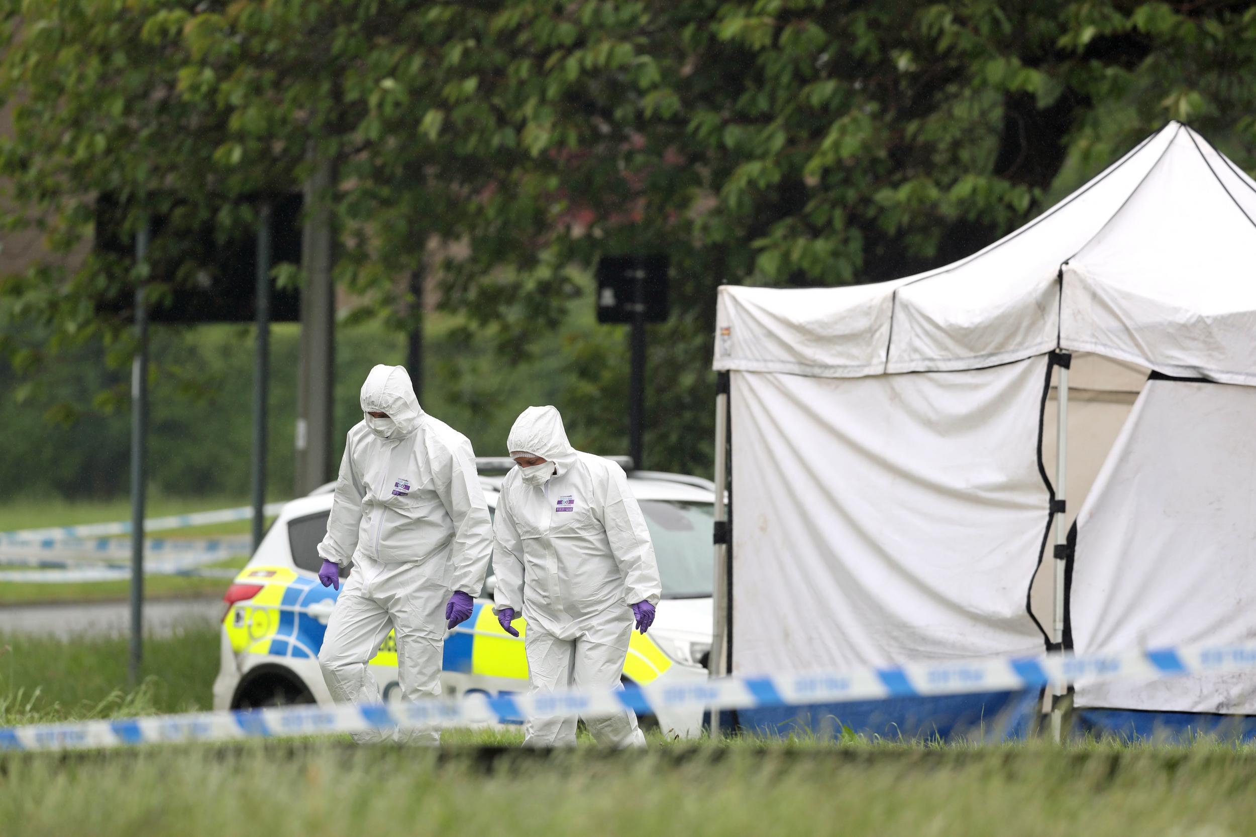 Forensic officers at the scene in Lowedges Road in Sheffield