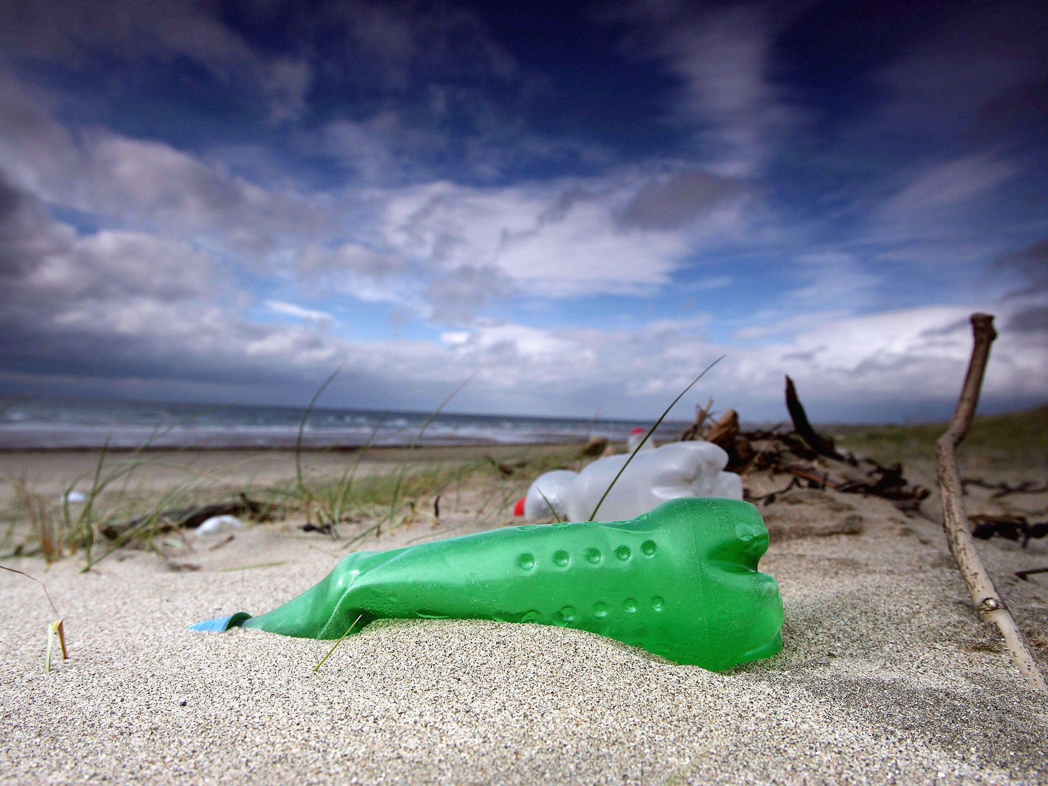 Plastic bottles and general rubbish washed up by the sea litter the beaches in Prestwick, Scotland