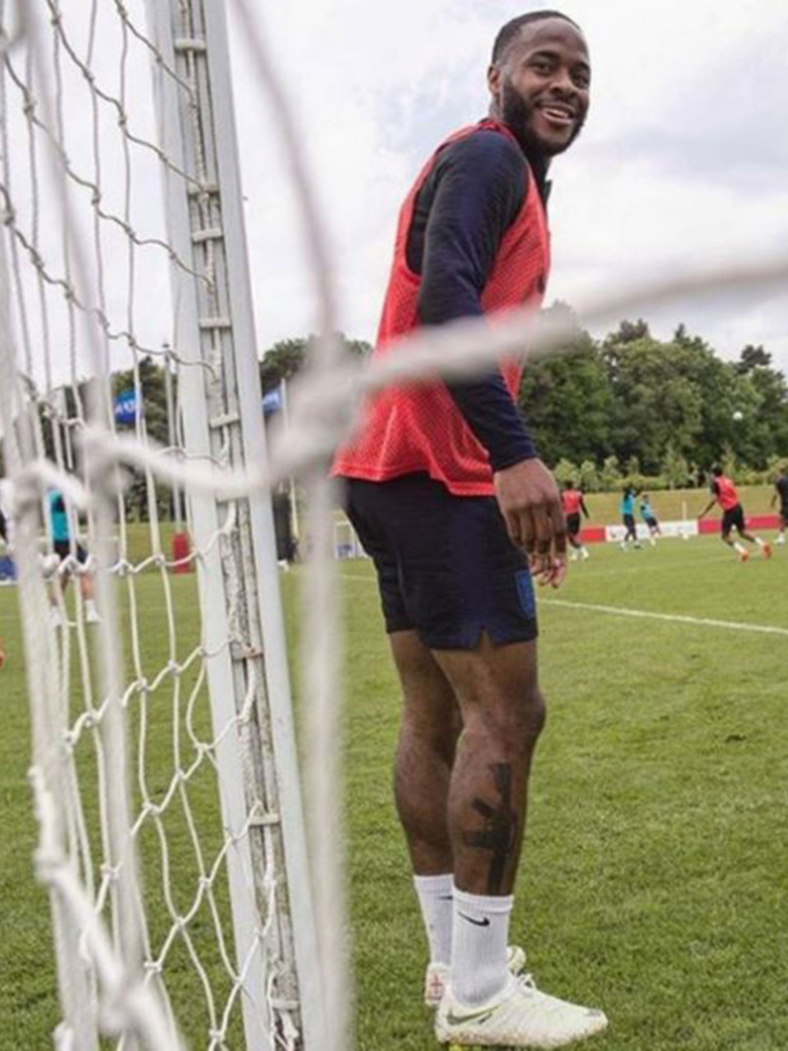 Sterling showed off his new tattoo at England training