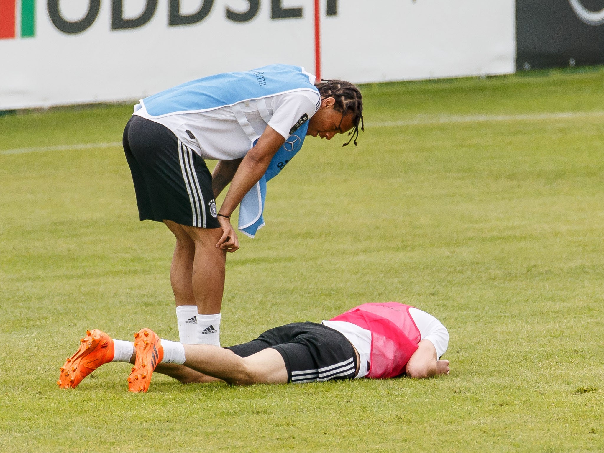 Julian Draxler reacts after being elbowed in the head during a Germany training session