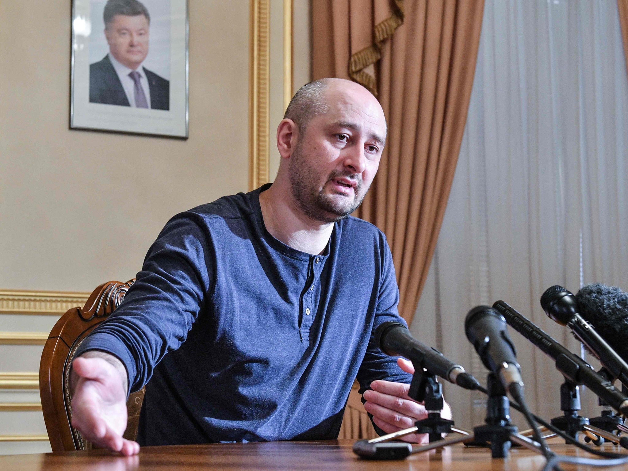 Arkady Babchenko addresses a press conference