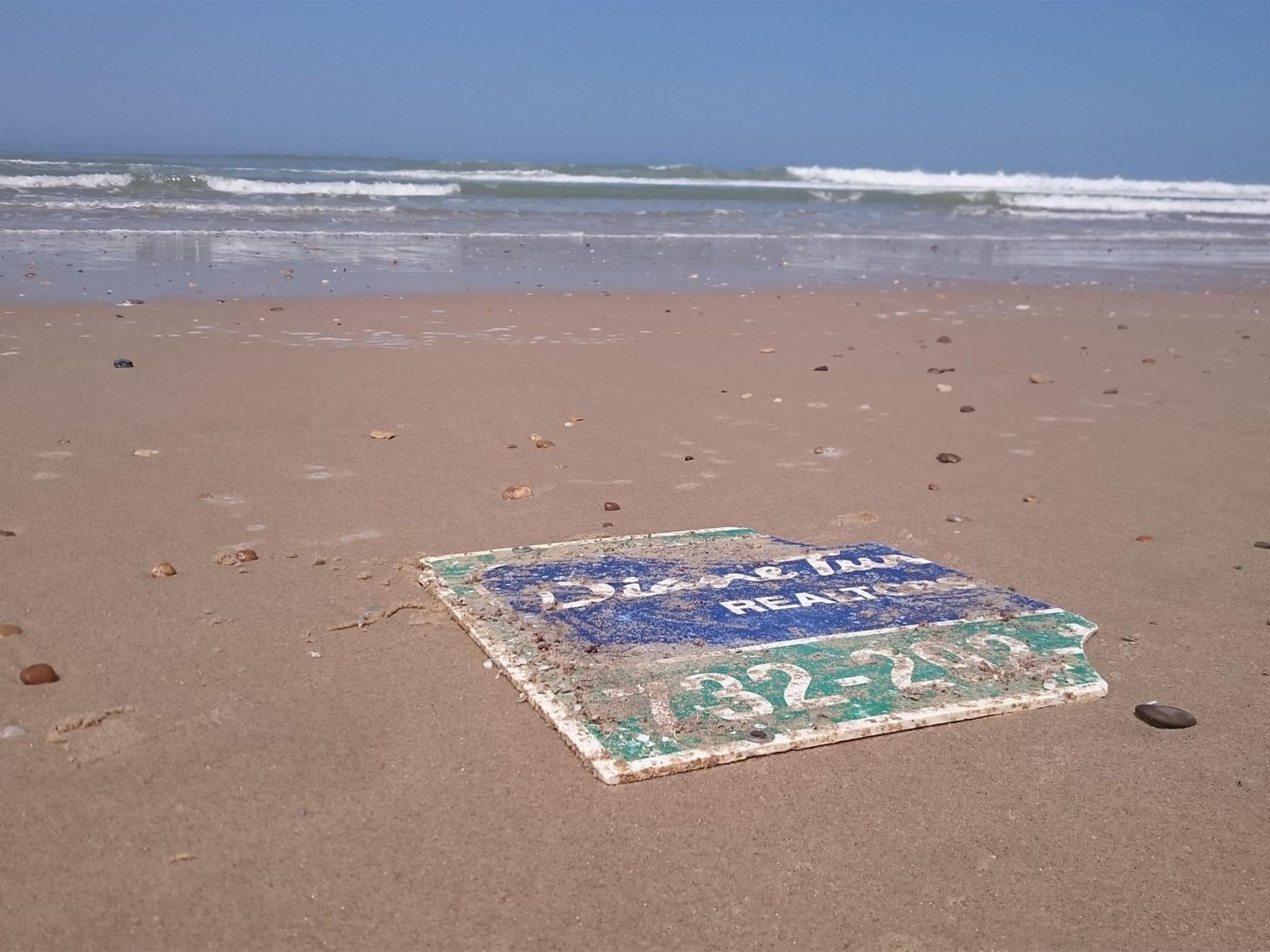 The sign washed up nearly 4,000 miles away from New Jersey