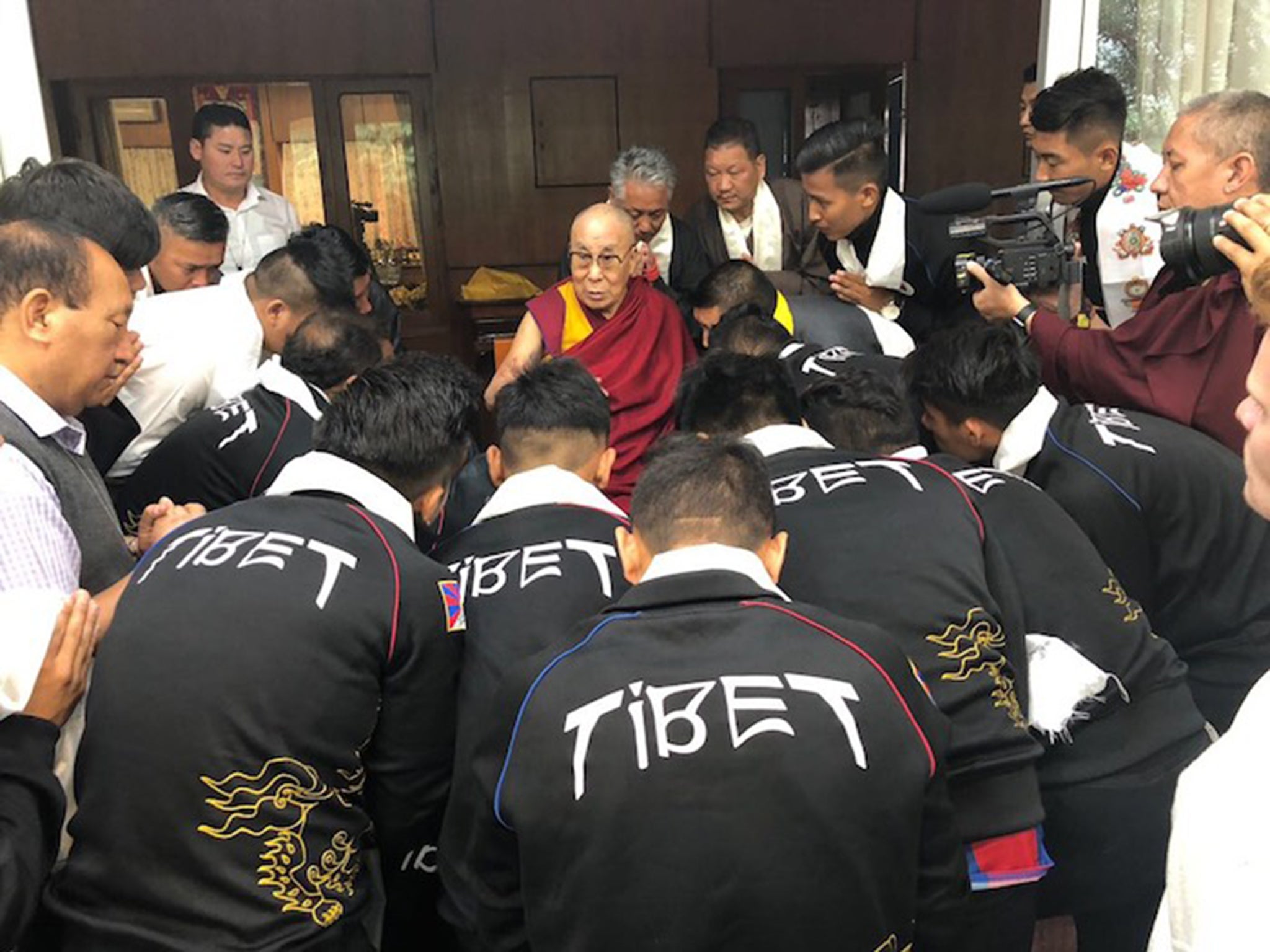 The Tibetan national football team meet the Dalai Lama