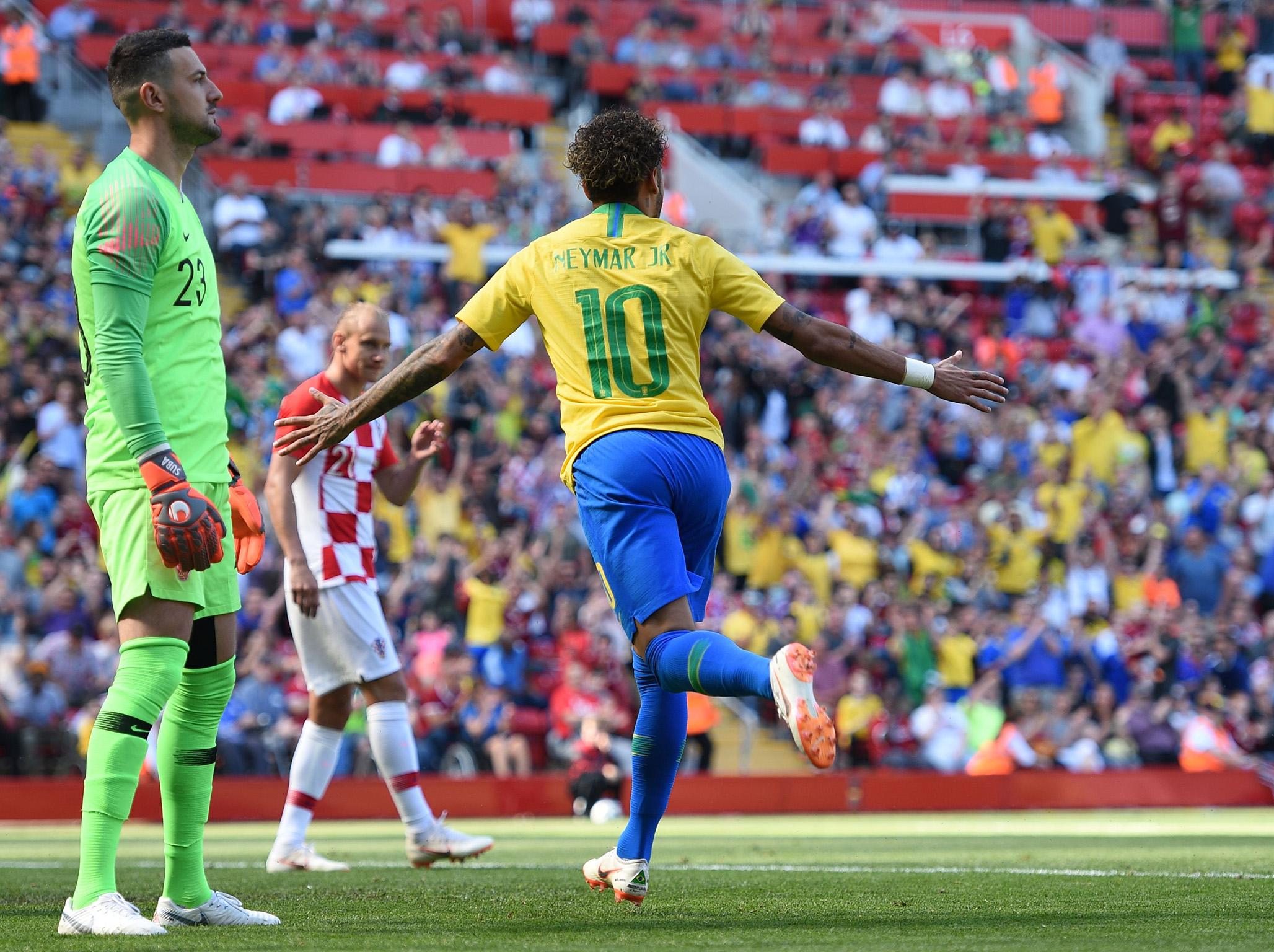 Neymar celebrates his well-taken strike off the bar