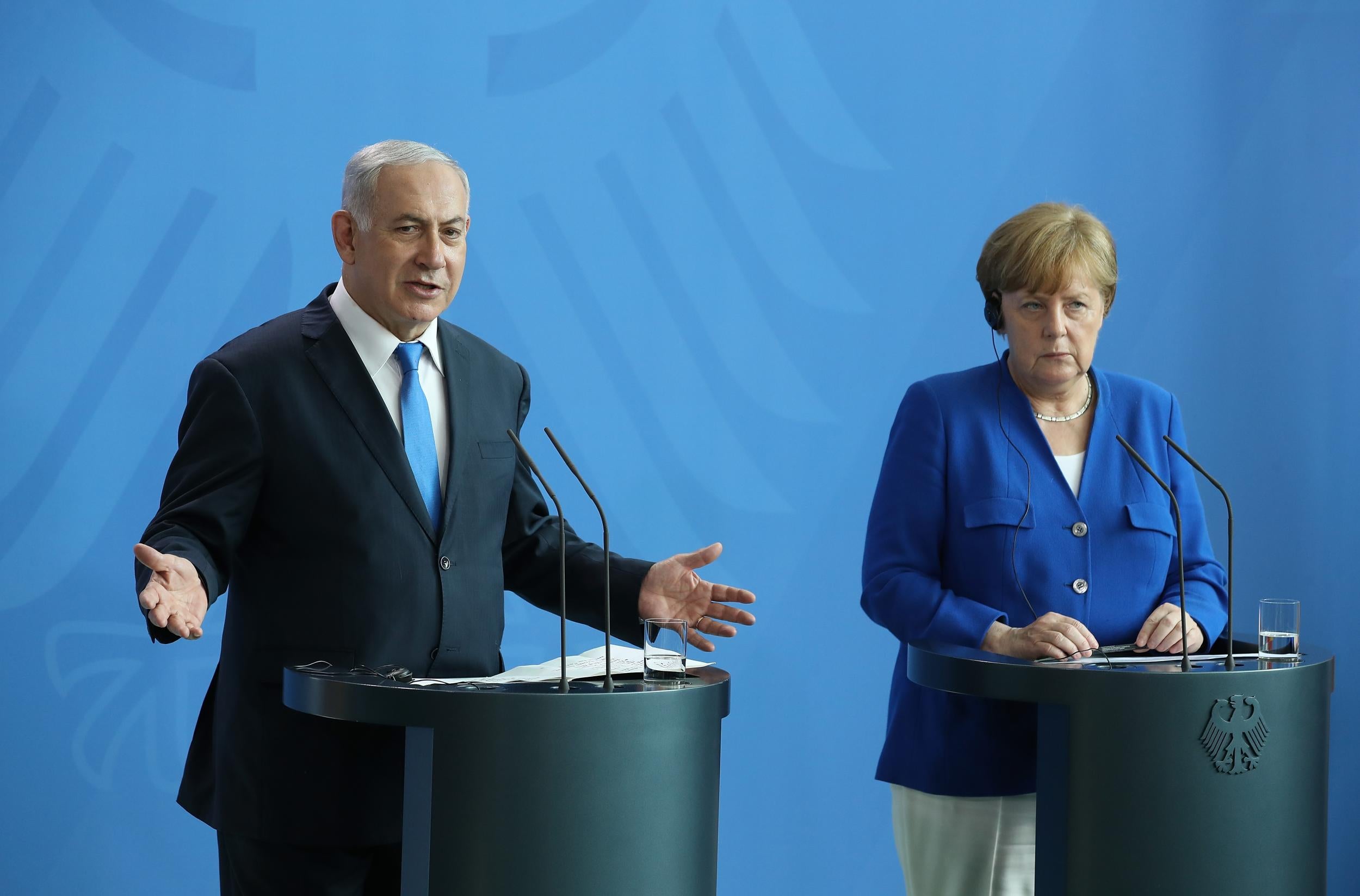 Angela Merkel and Israeli Prime Minister Benjamin Netanyahu speak at a joint press conference in Berlin