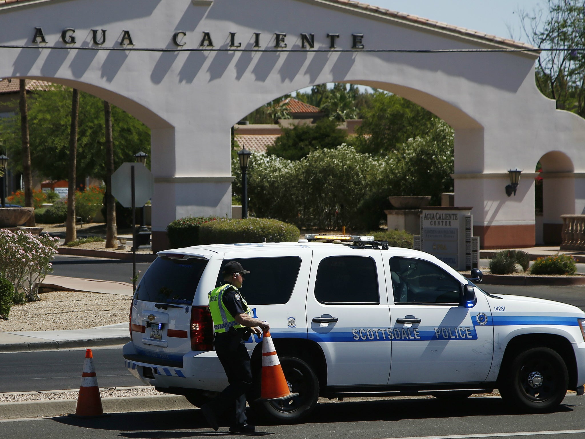 Police block off access to a business plaza as they surround a hotel where a suspect wanted in several killings was staying 4 June 2018, in Scottsdale, Arizona. According to police, the suspect killed himself as police closed in on the hotel.