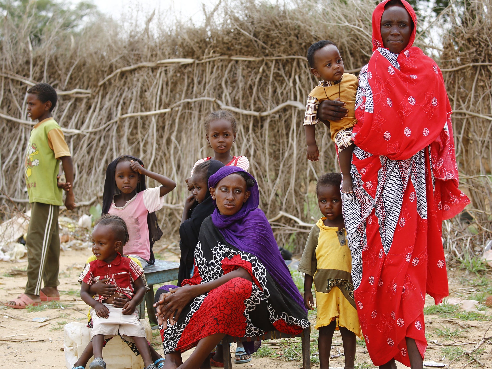 The chief and her community are vulnerable, displaced persons, living in a sort of internal refugee camp