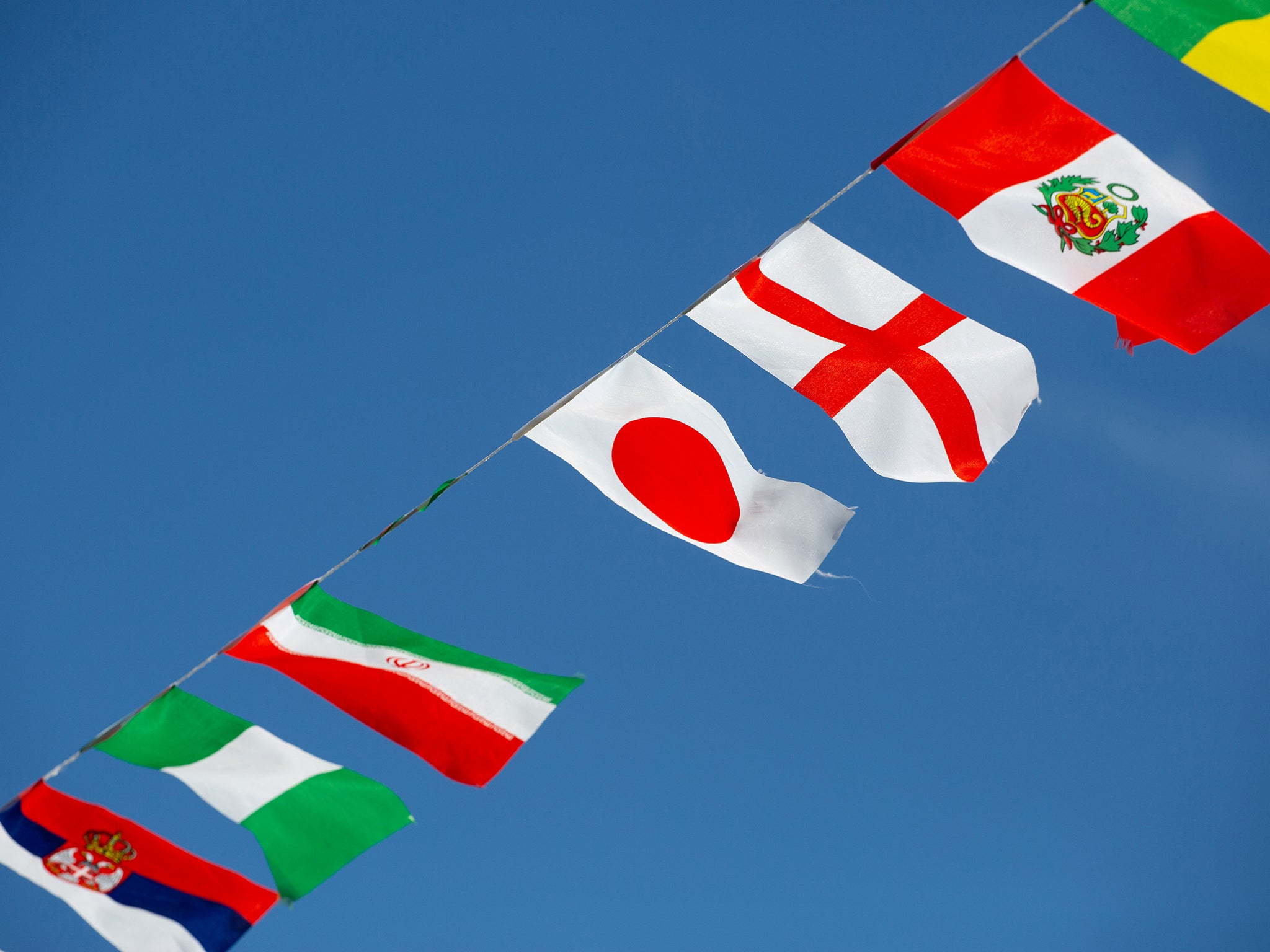 Bunting with a space where the Saudia Arabia flag was removed outside Greene King pub The Air Balloon in Filton, Bristol